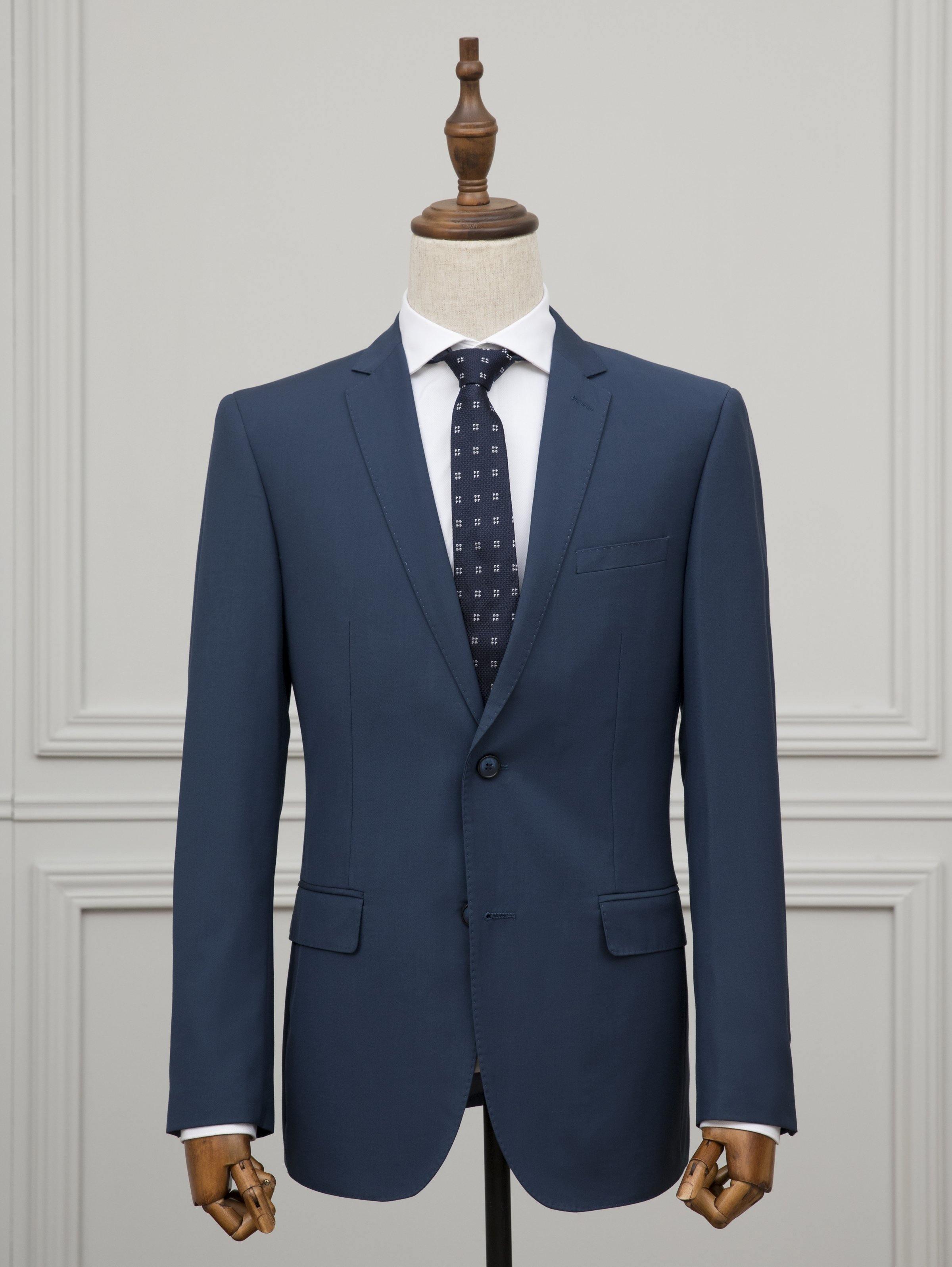 Blue two-button suit jacket with notch lapels, white shirt, and patterned tie