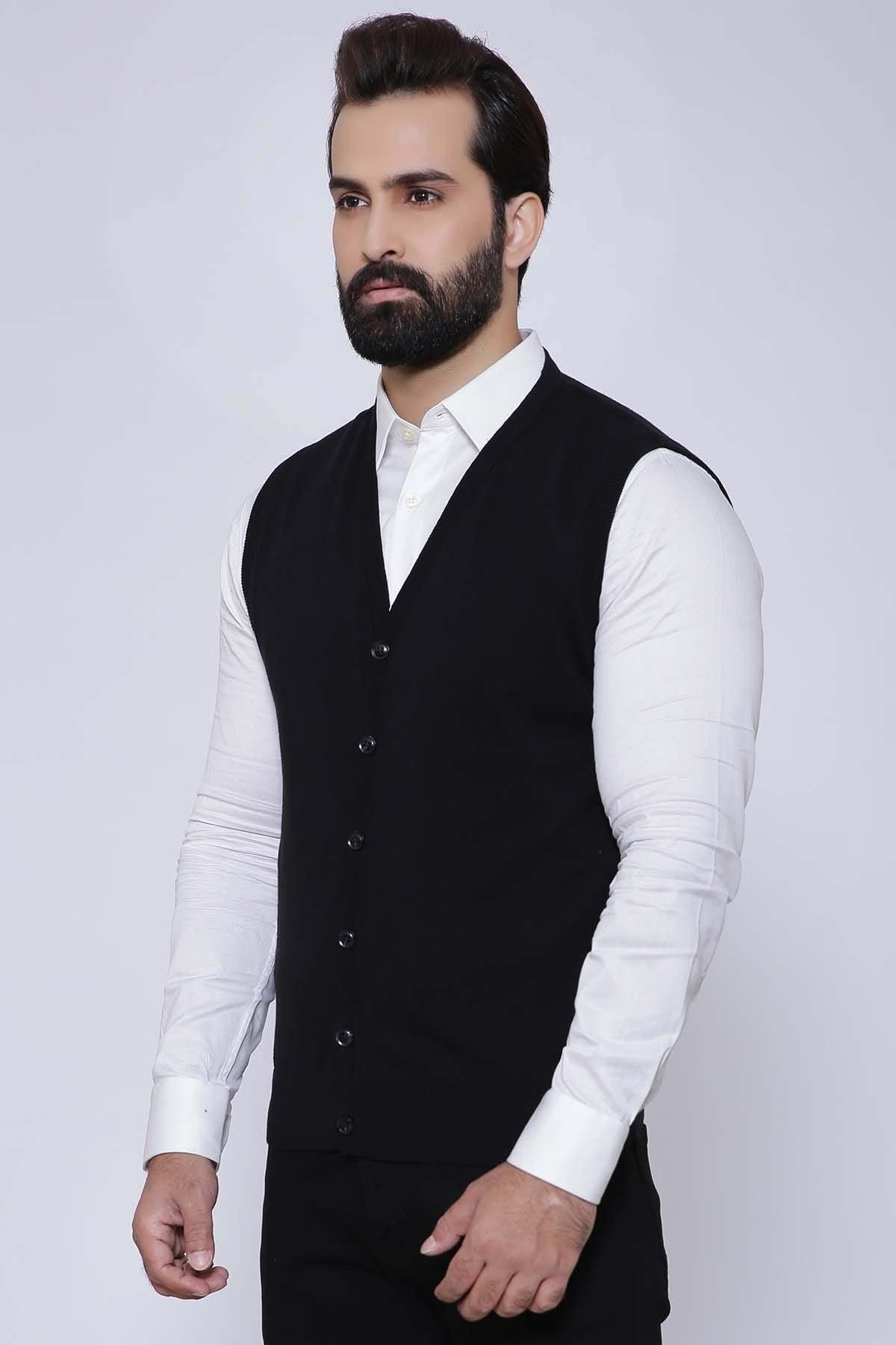 Black sleeveless cardigan vest over white shirt, V-neck and button closure