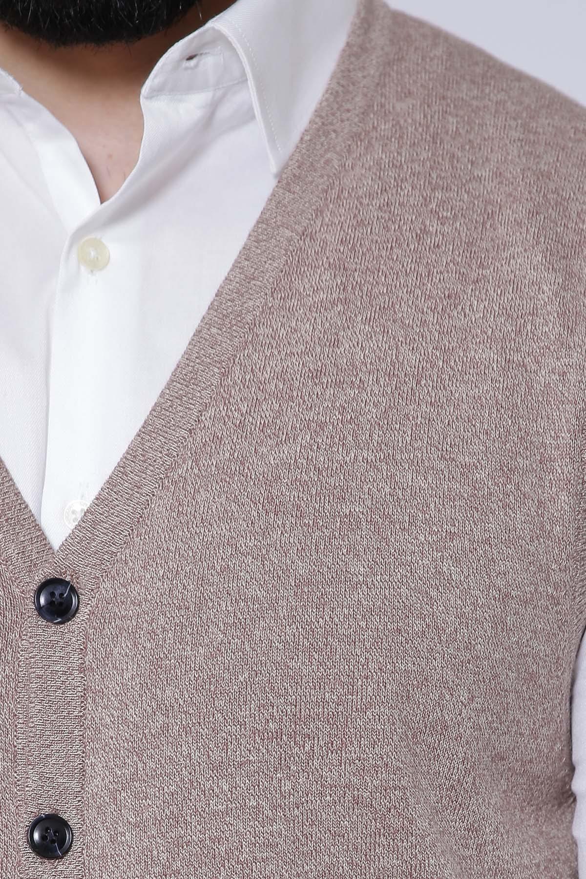 Khaki sleeveless cardigan close-up of black buttons and knit texture