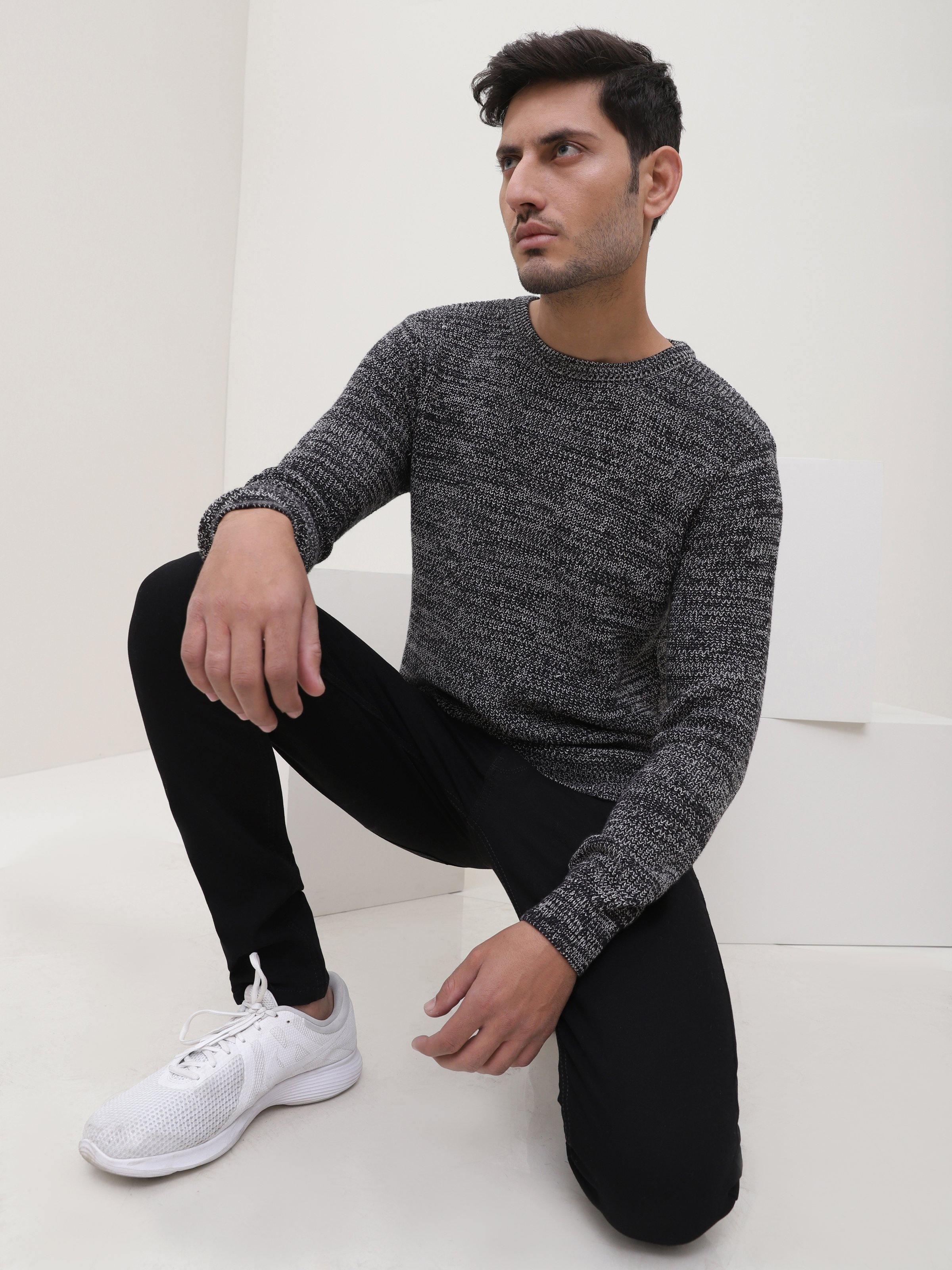 Crew-neck knit sweater in dark heather gray with long sleeves and ribbed hem