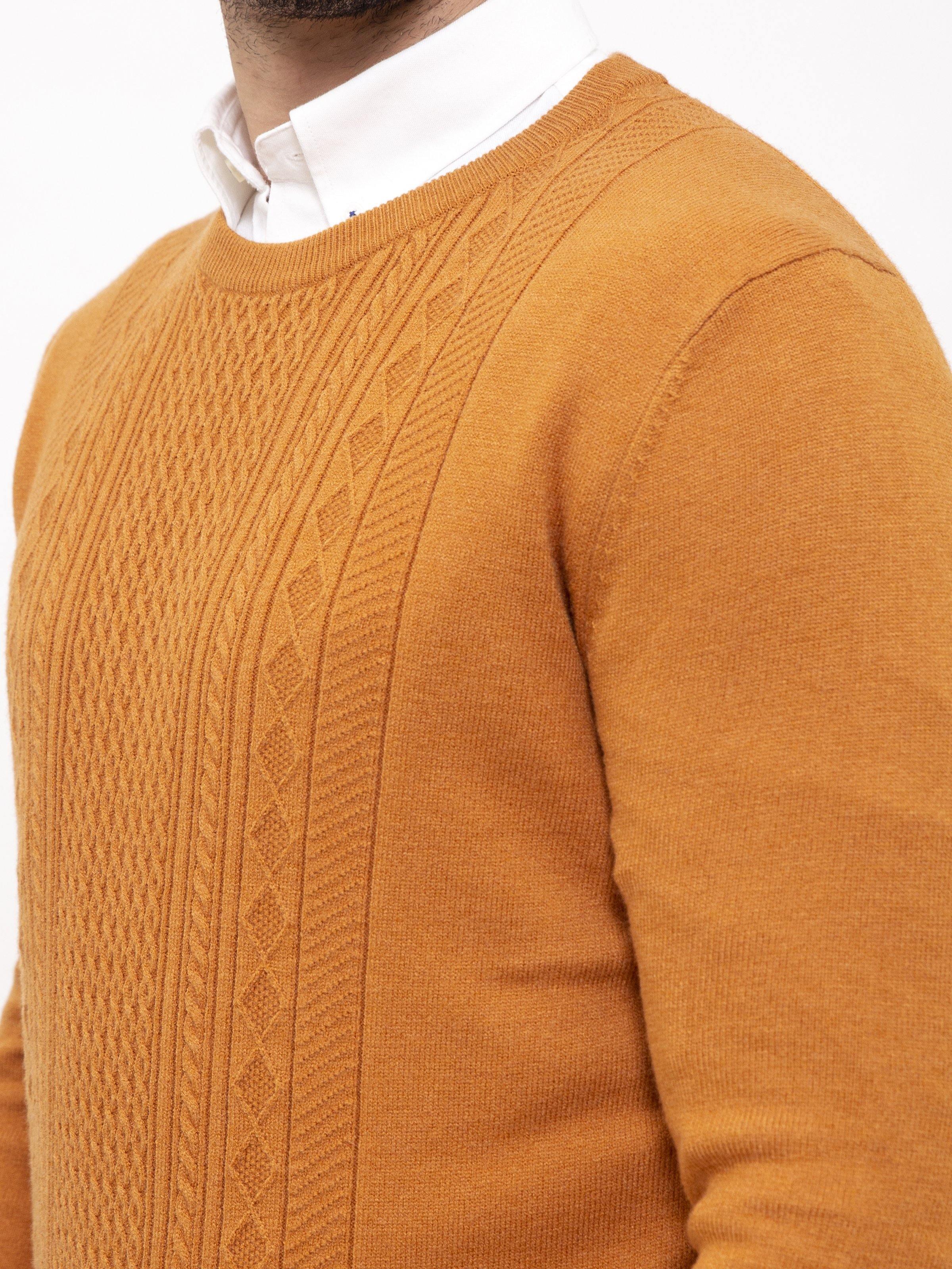 Mustard sweater close-up, cable knit texture and crew neck ribbing
