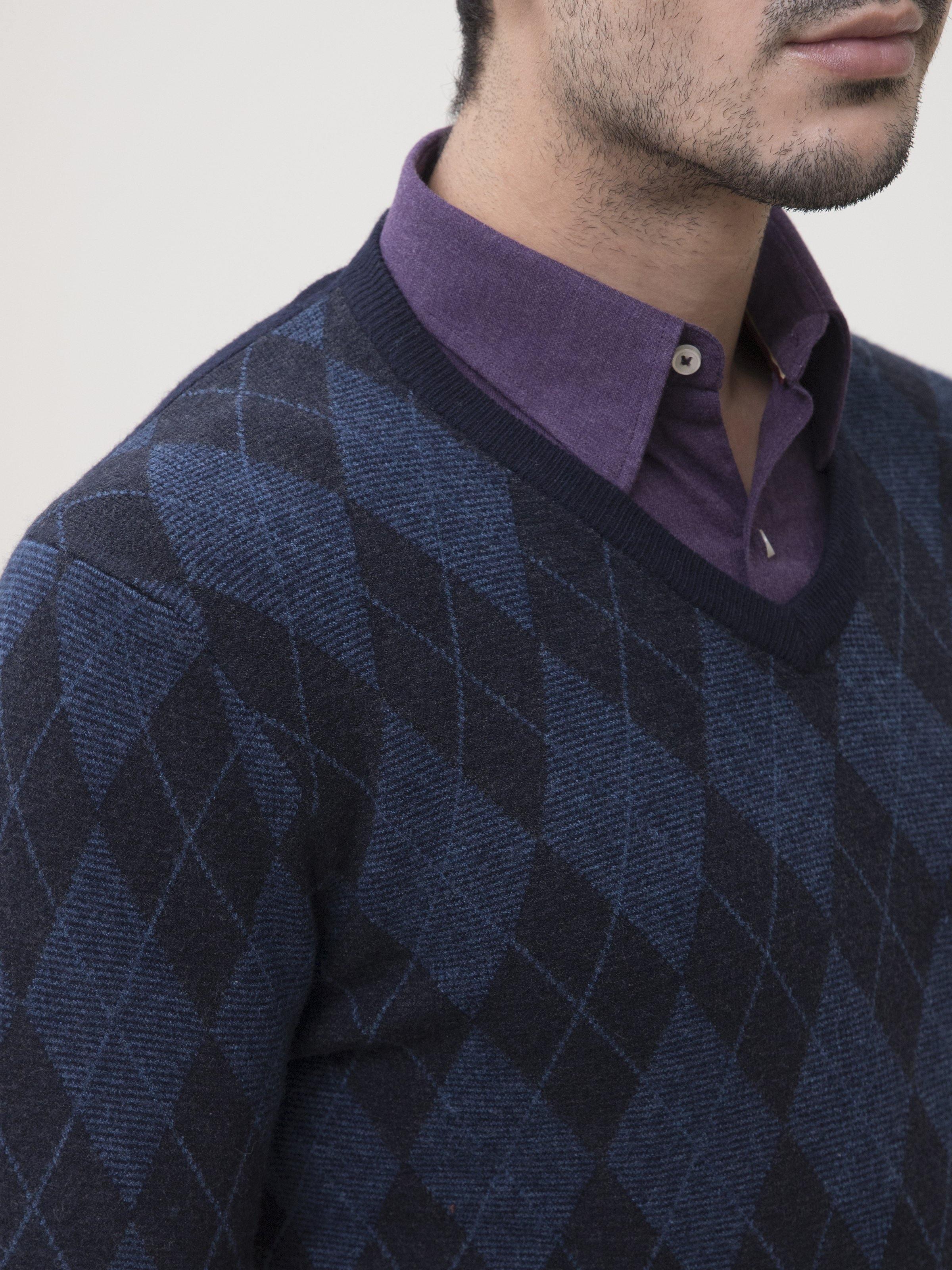 Dark navy V-neck sweater close-up of diamond argyle knit