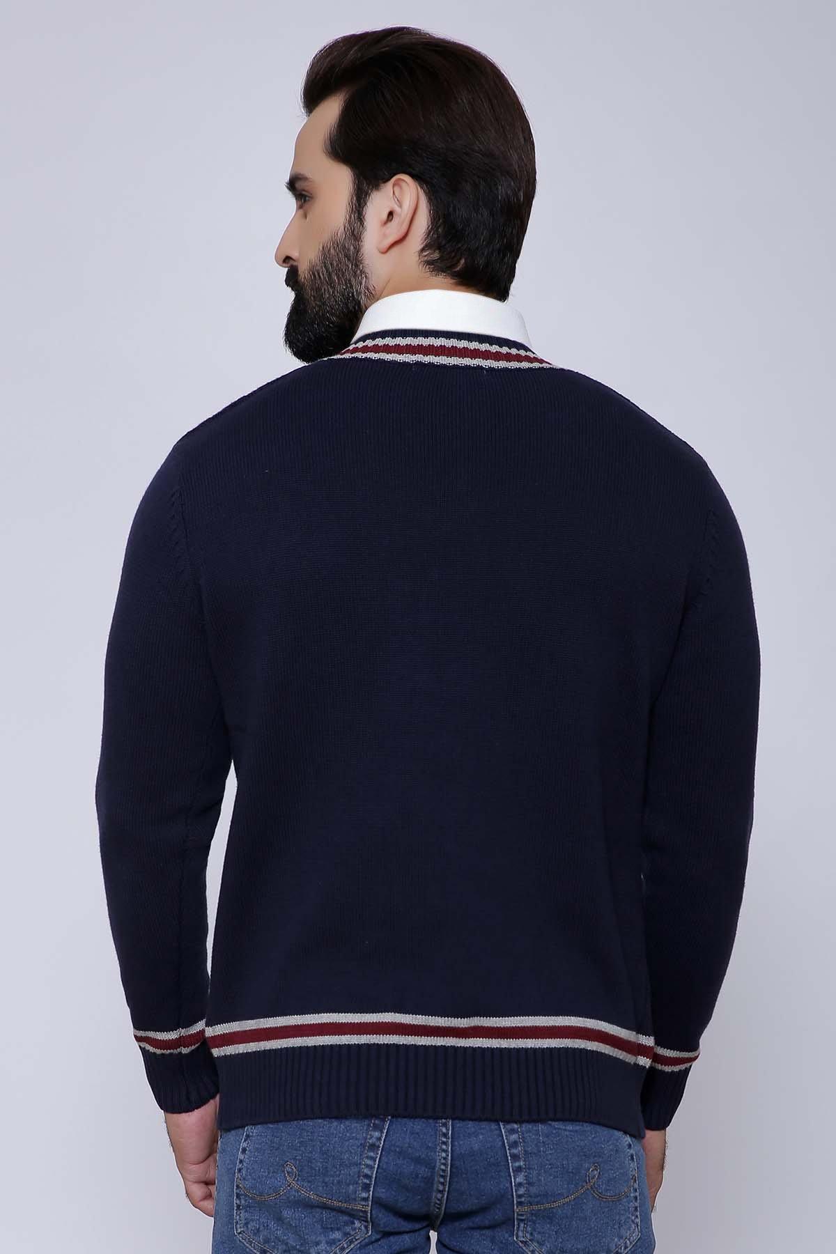 Back view of navy cable-knit V-neck sweater with striped hem and cuffs