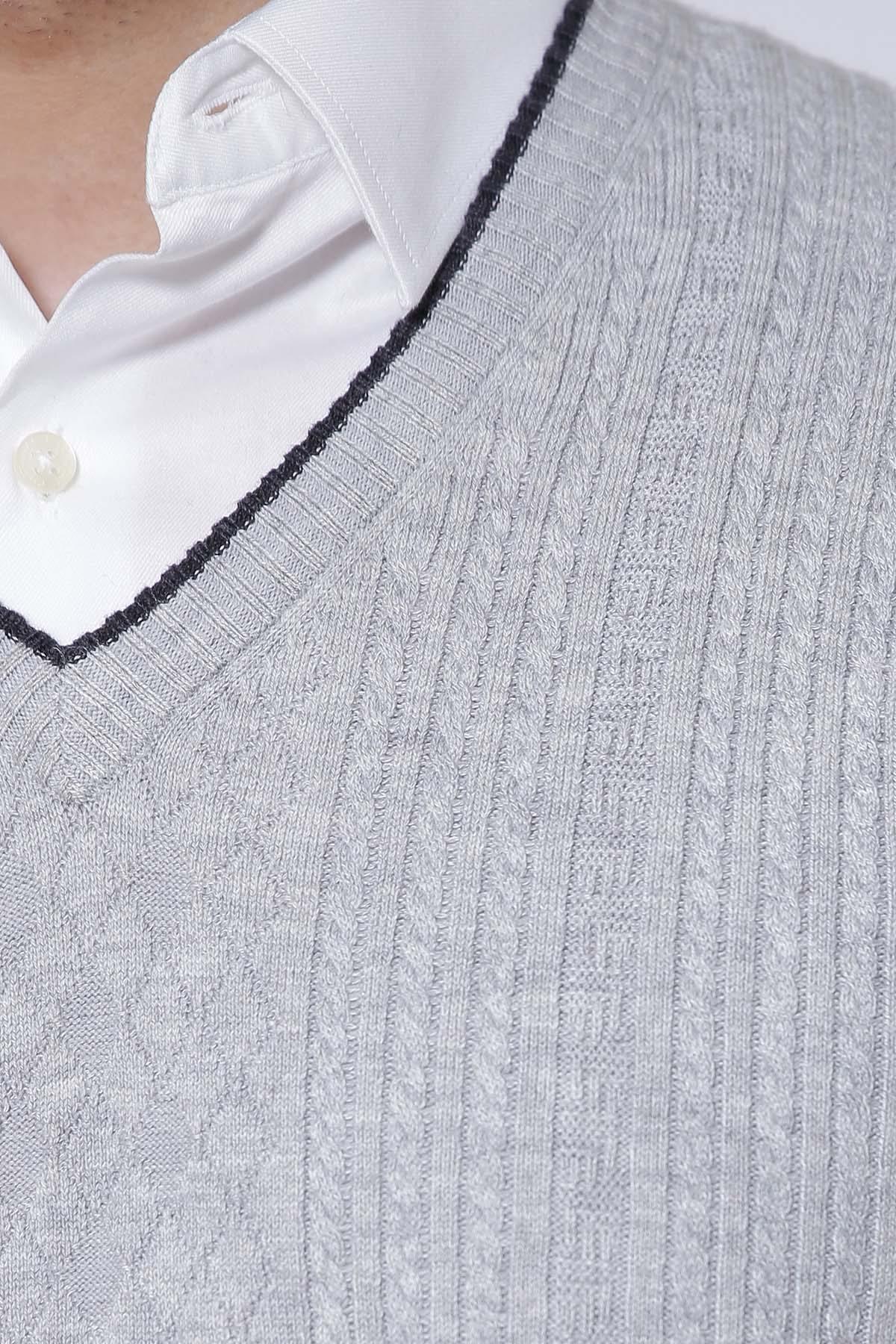 Light grey knit V-neck sleeveless sweater vest with dark trim detail.