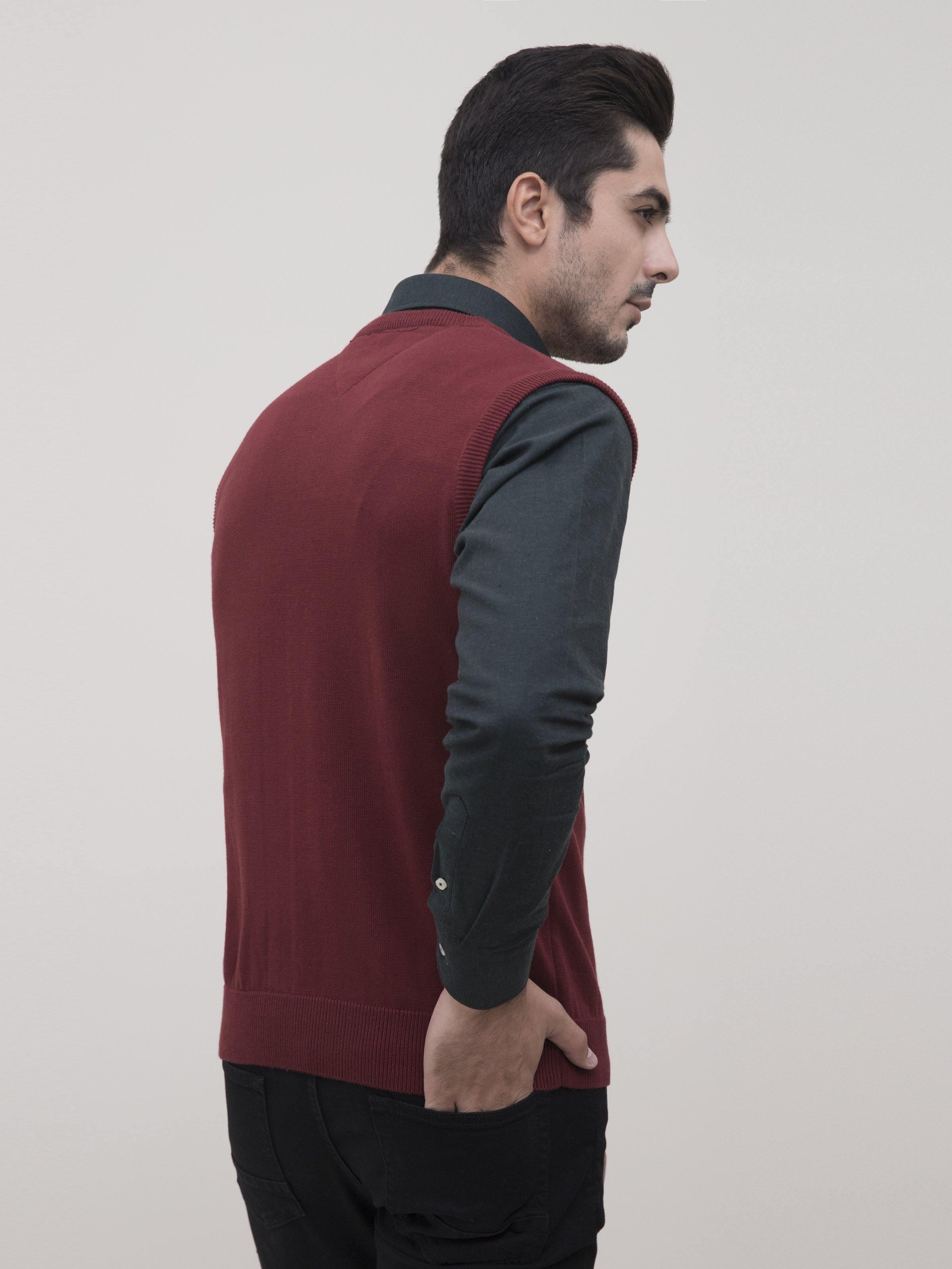 Maroon V-neck sleeveless sweater vest side view, ribbed collar and hem