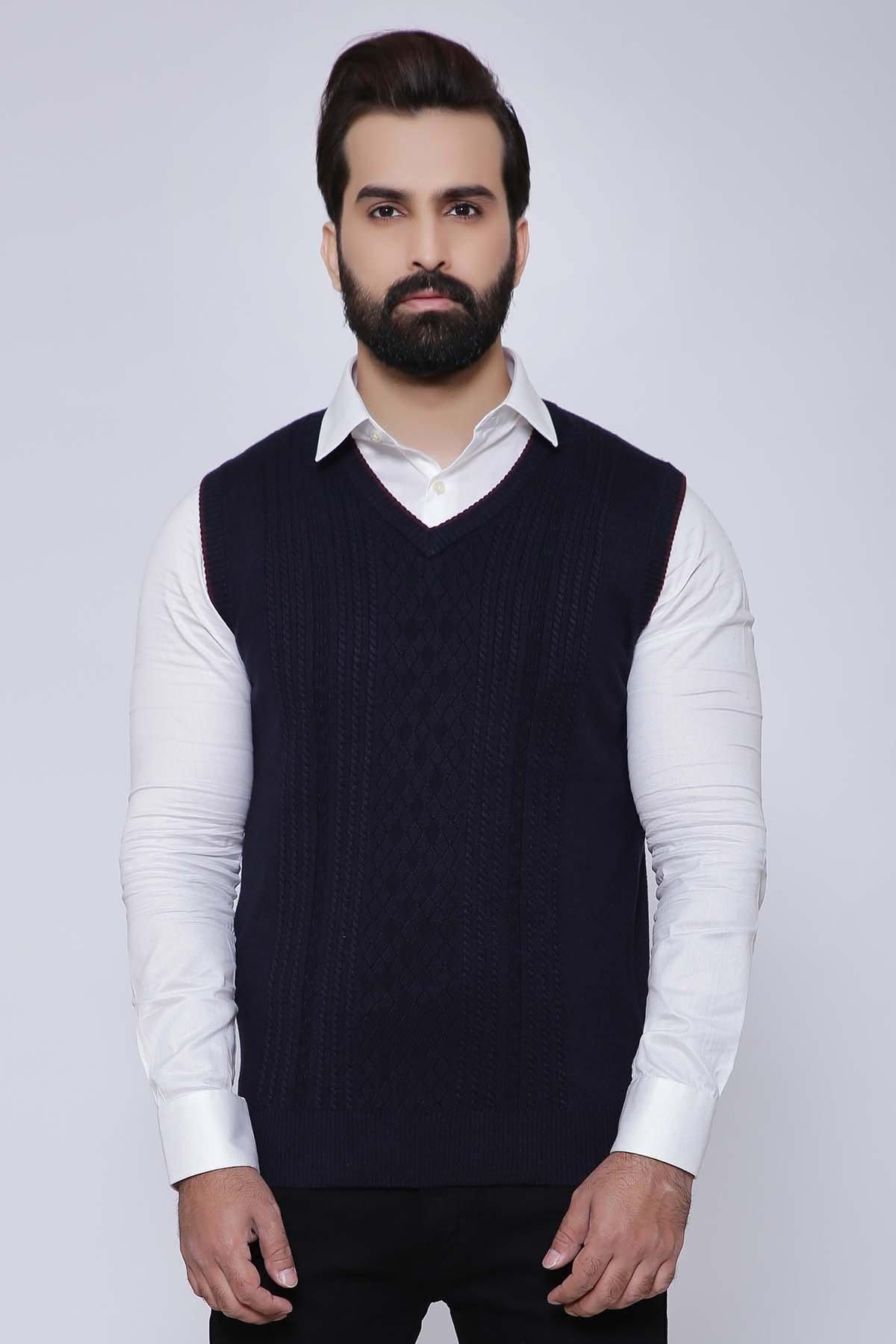 V-neck sleeveless sweater vest in dark navy, ribbed knit, worn over a white shirt