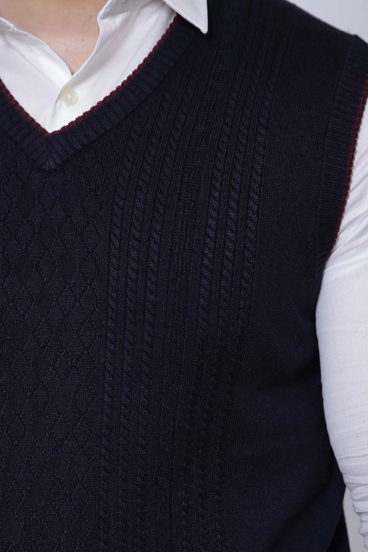 Dark navy V-neck sweater vest close-up, cable-knit texture and ribbed neckline