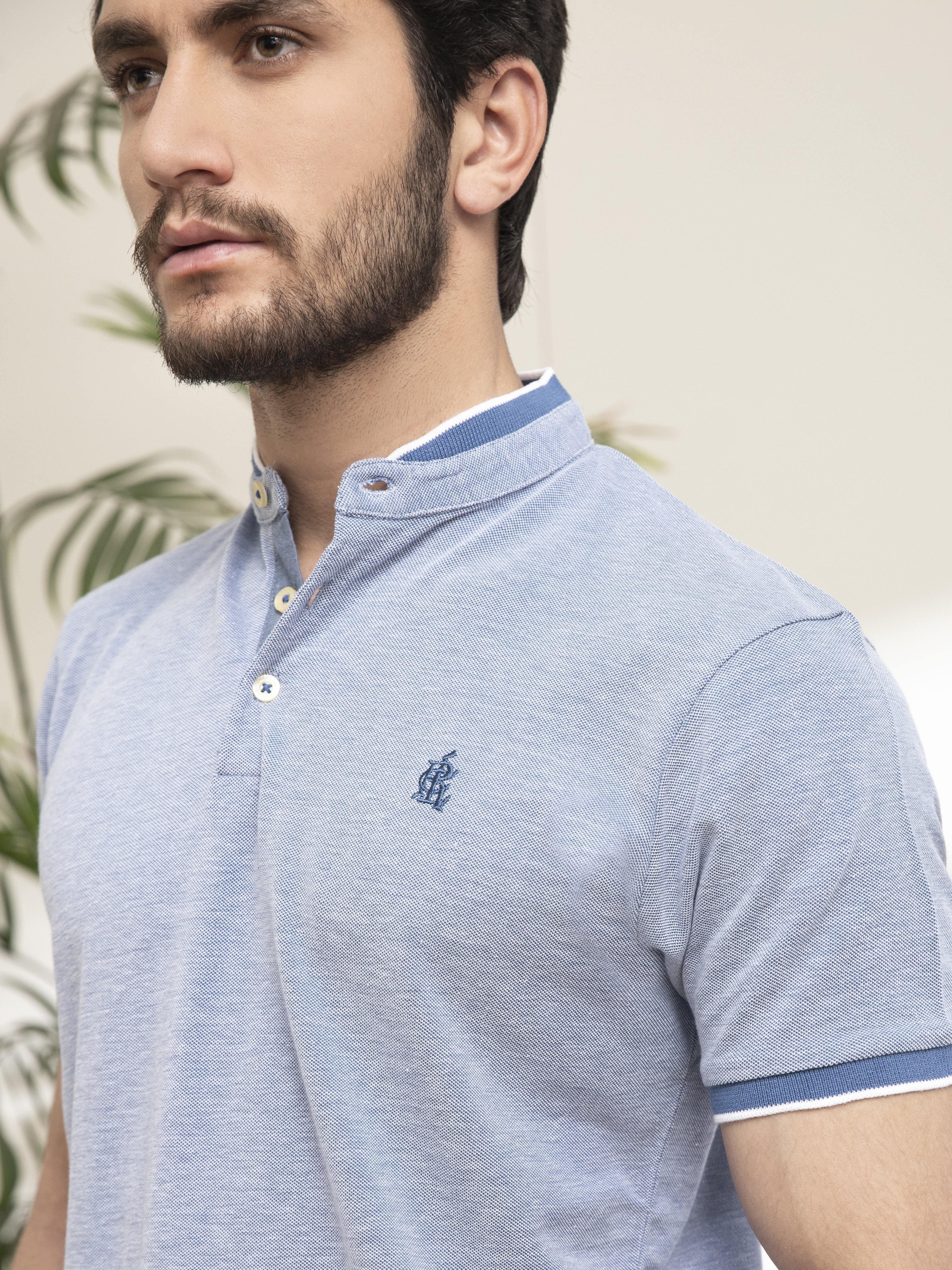 Sky blue band-collar polo shirt with button placket and chest embroidery, close-up