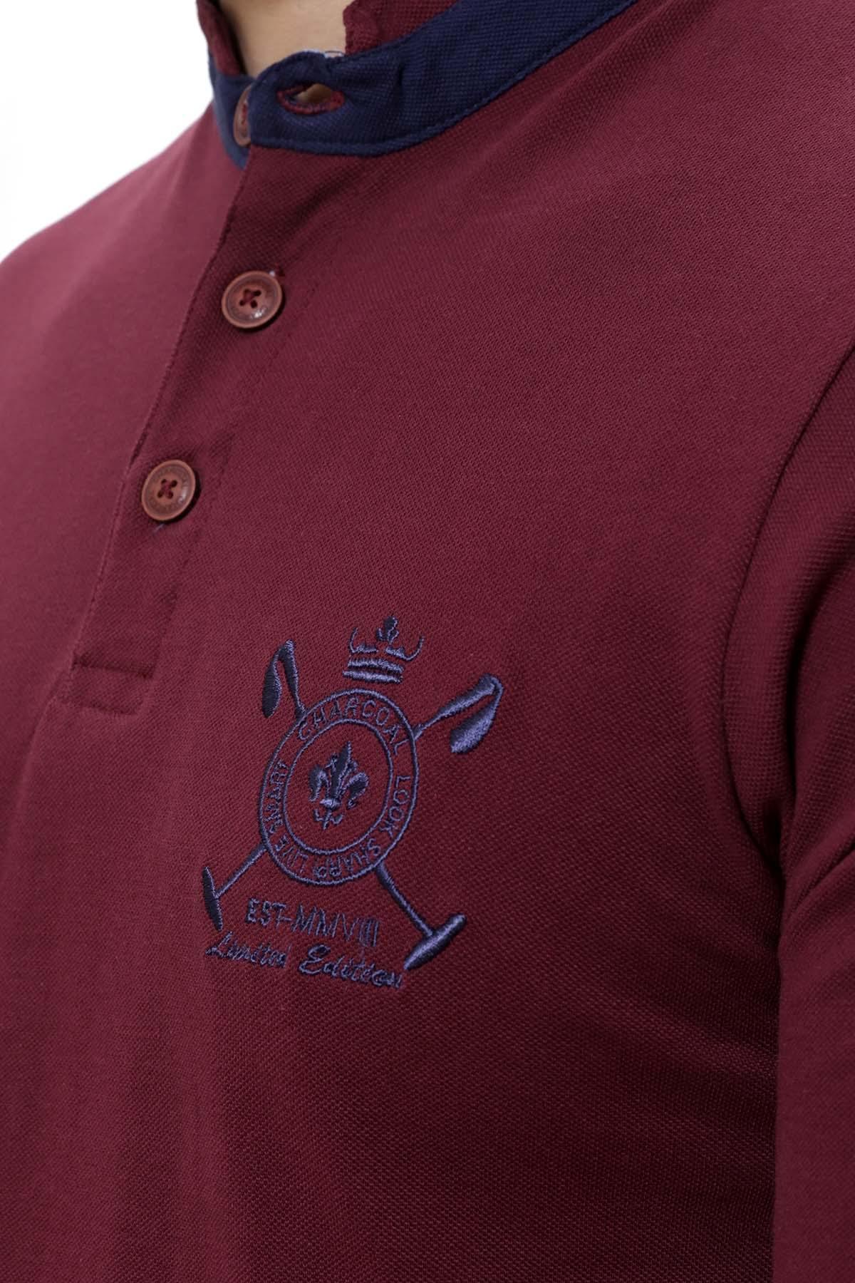 Maroon long-sleeve henley T-shirt close-up of buttons and chest emblem