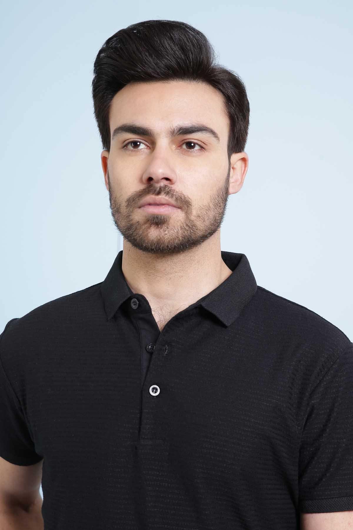 Black polo shirt front view, button placket and raised collar details