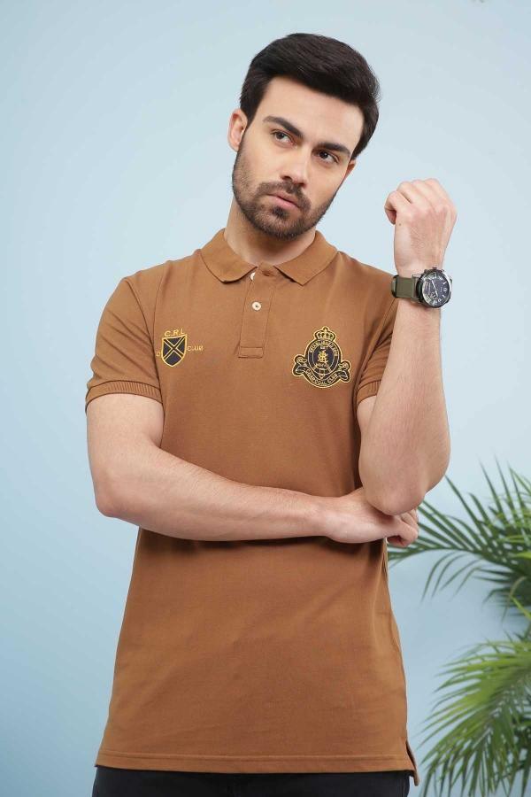 Men's khaki polo shirt with collar, button placket, and embroidered crest on chest