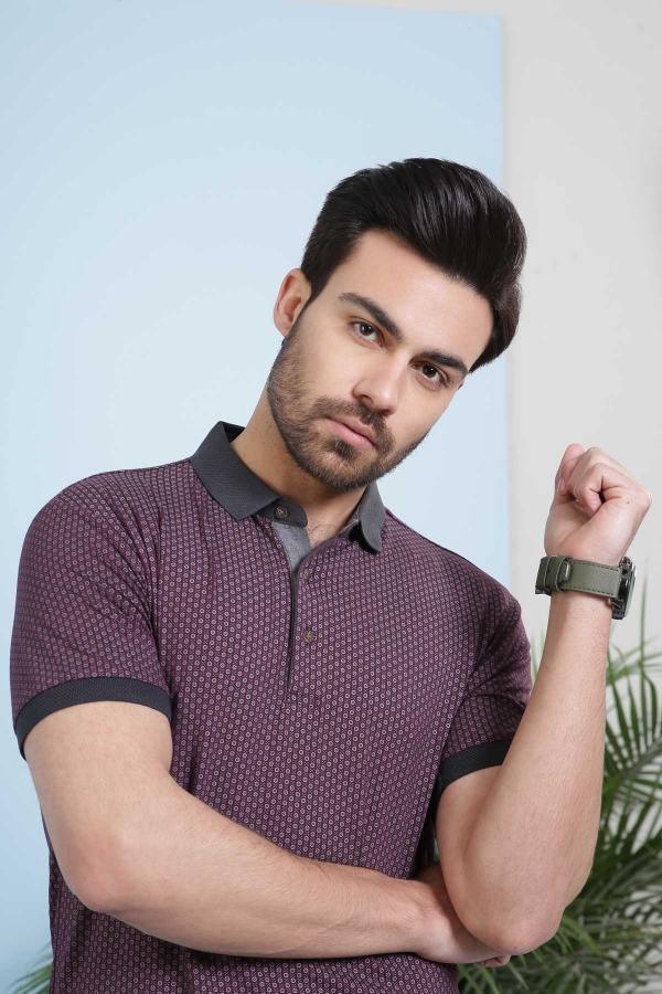Maroon polo shirt with dark trim collar, button placket, and dotted allover print