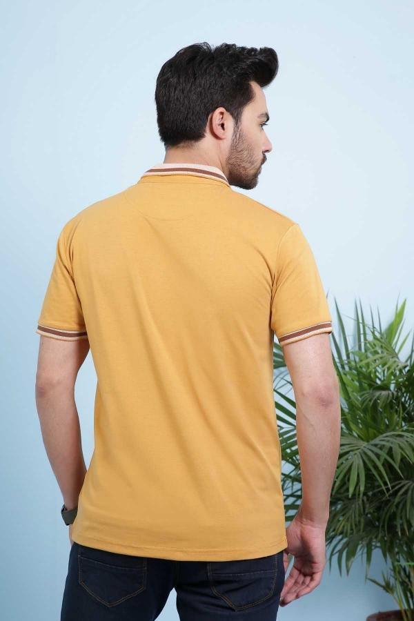 Mustard polo shirt from back view with short sleeves and striped collar trim