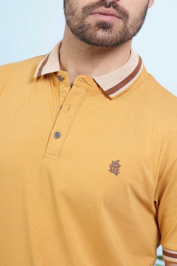Mustard polo shirt close-up with collar, button placket, and small chest logo