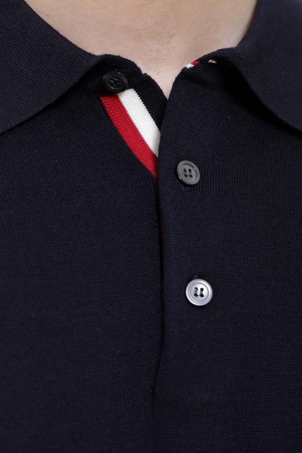 Navy polo collar with red-and-white stripe and button detail