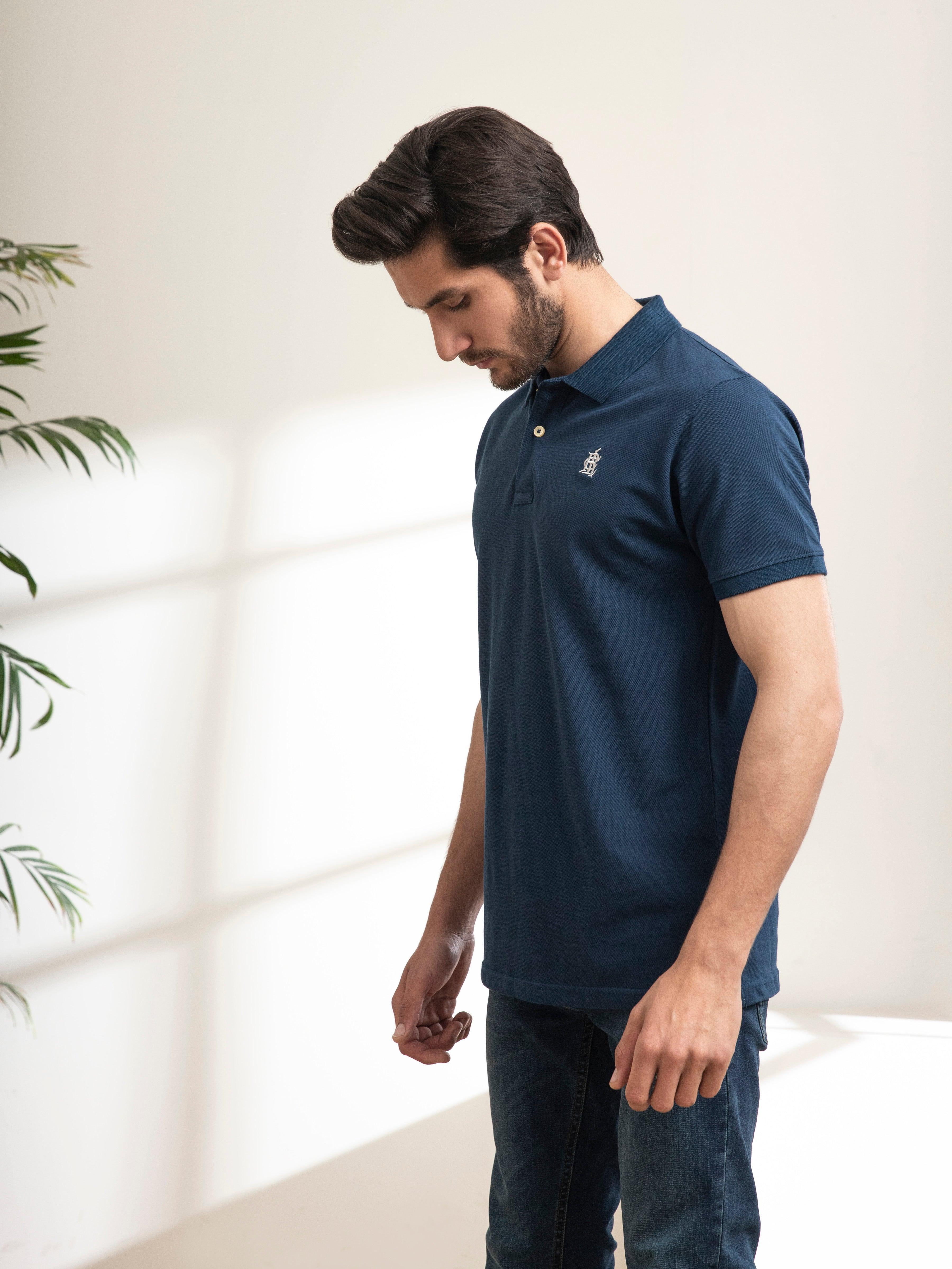 Teal polo T-shirt with short sleeves and button placket, front side profile