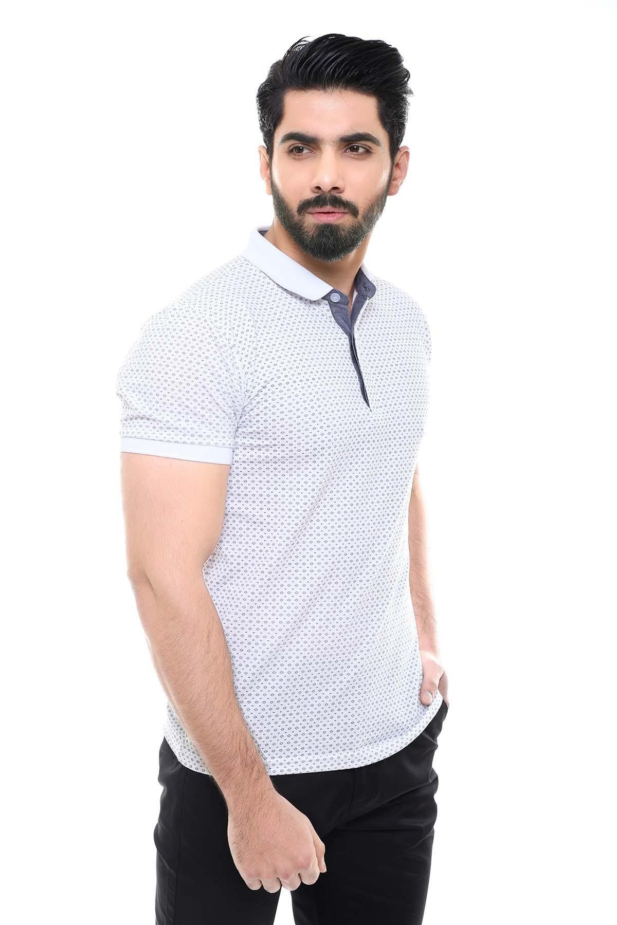 White polo T-shirt with short sleeves, button placket, and textured dot print, side view
