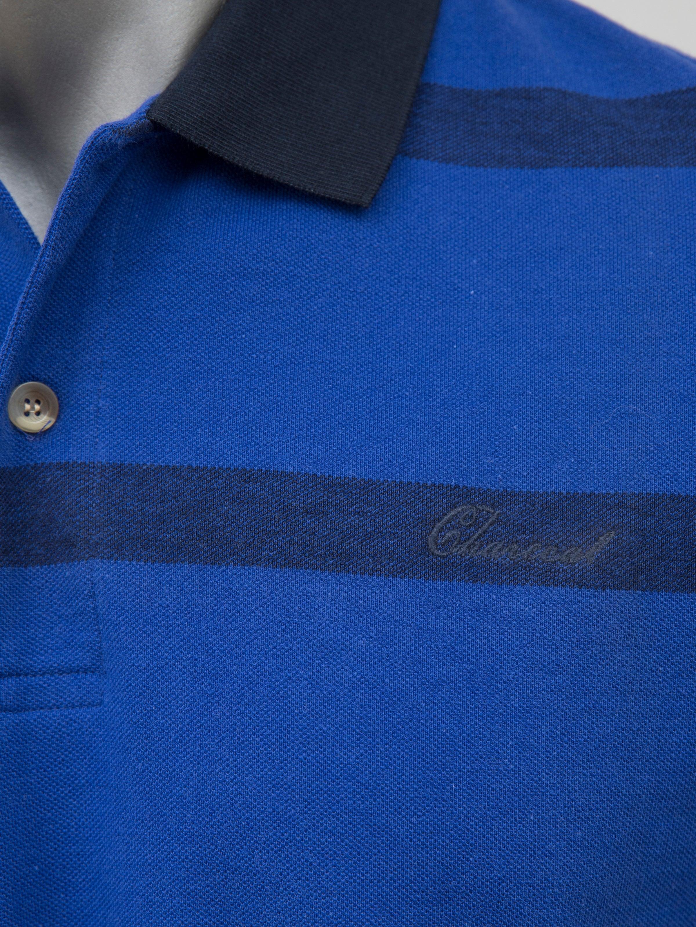 Blue polo shirt placket with dark stripe, three-button closure