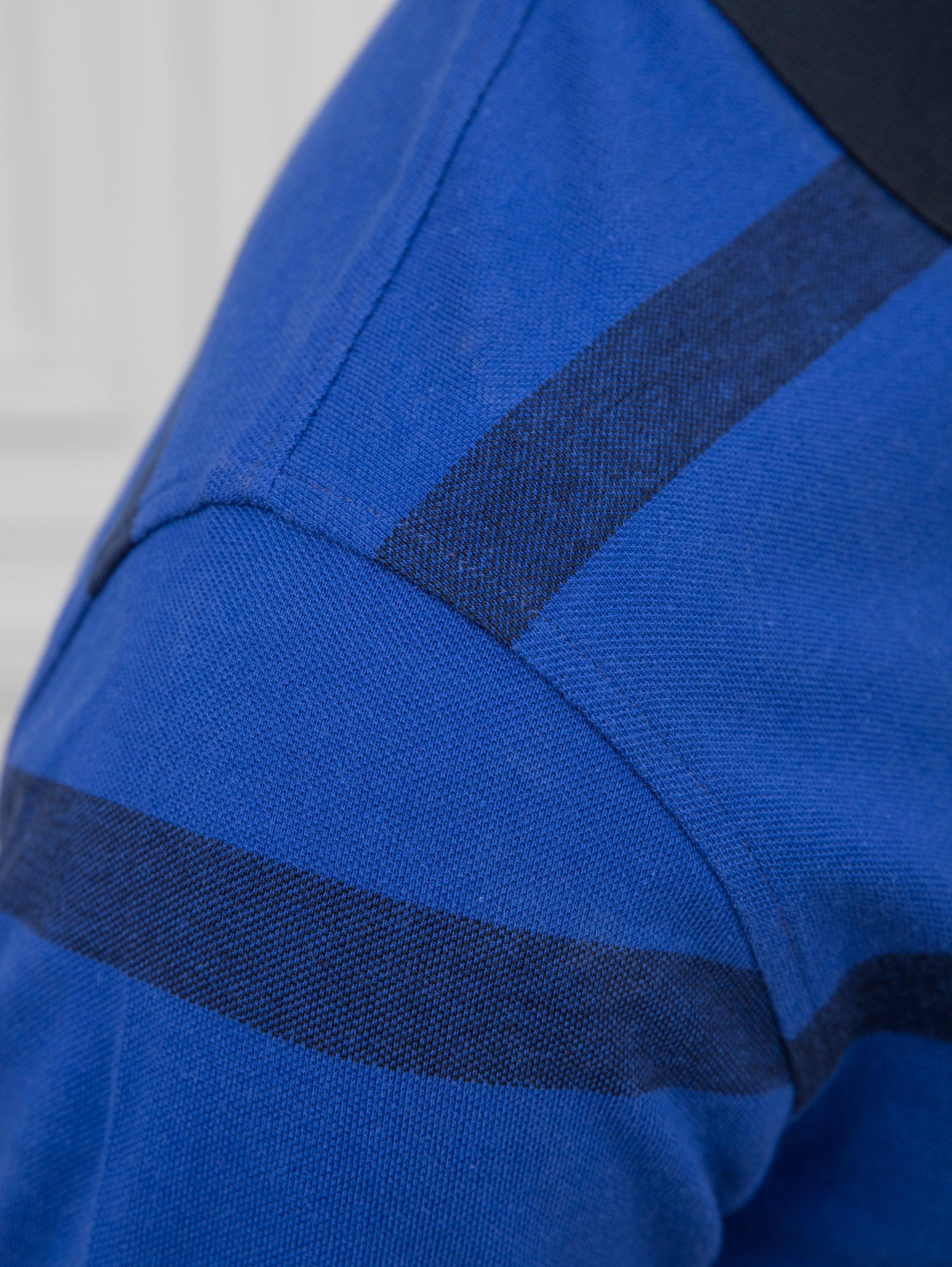 Blue polo shirt short sleeve with dark striped shoulder panel
