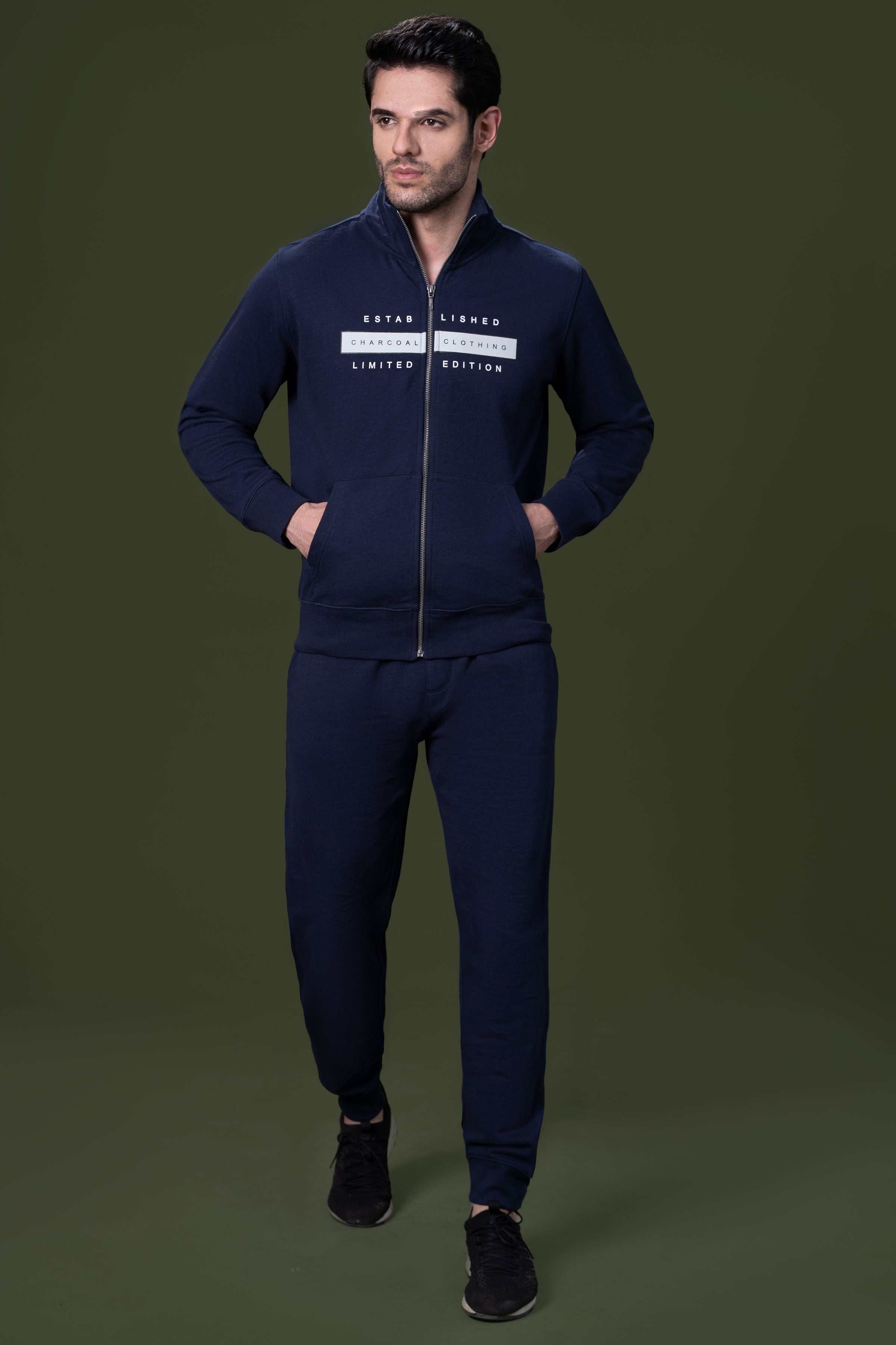 Navy terry jogger trousers with elastic waistband and tapered legs