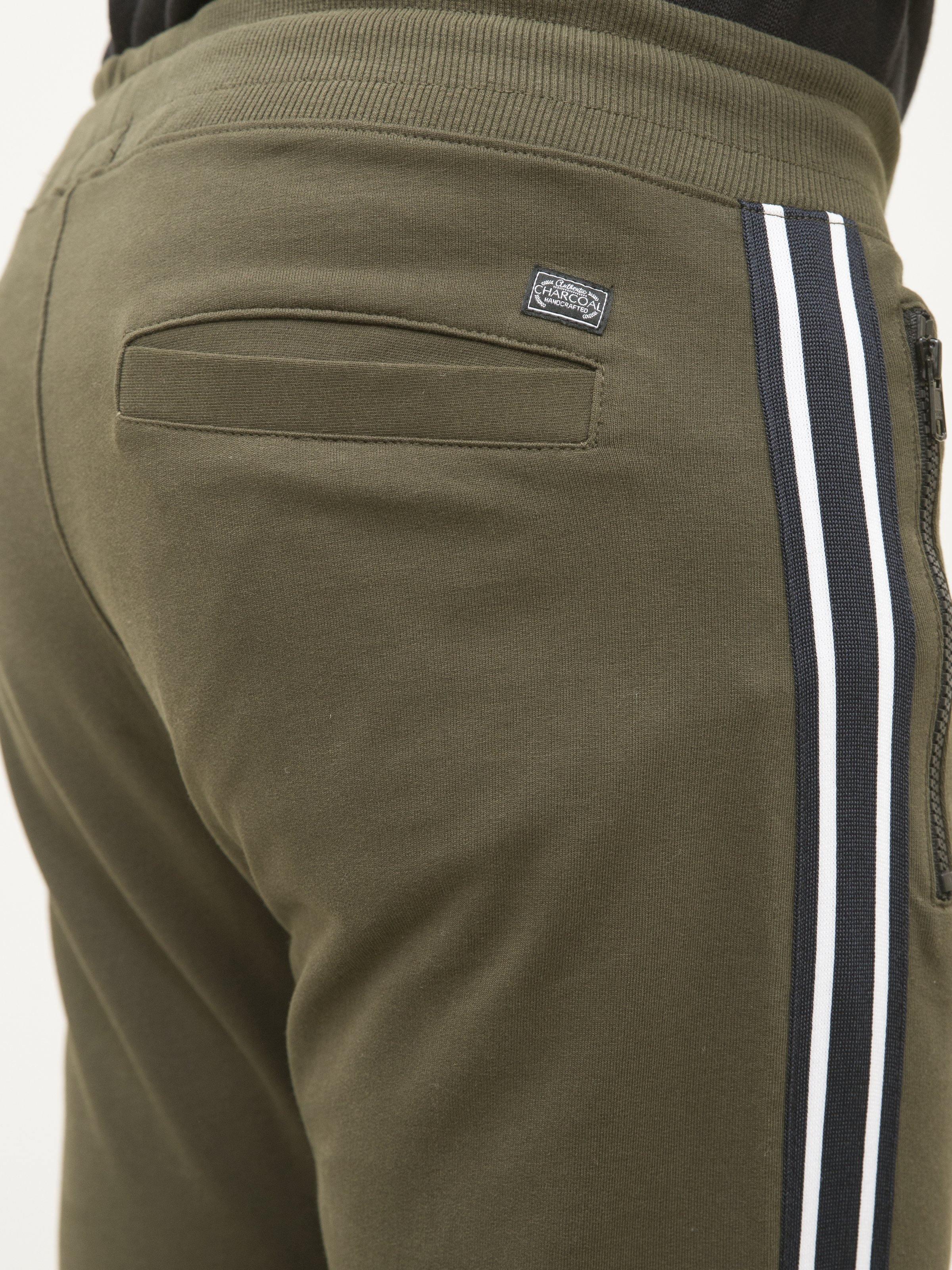 Dark olive terry trousers back pocket with label and side tape stripe