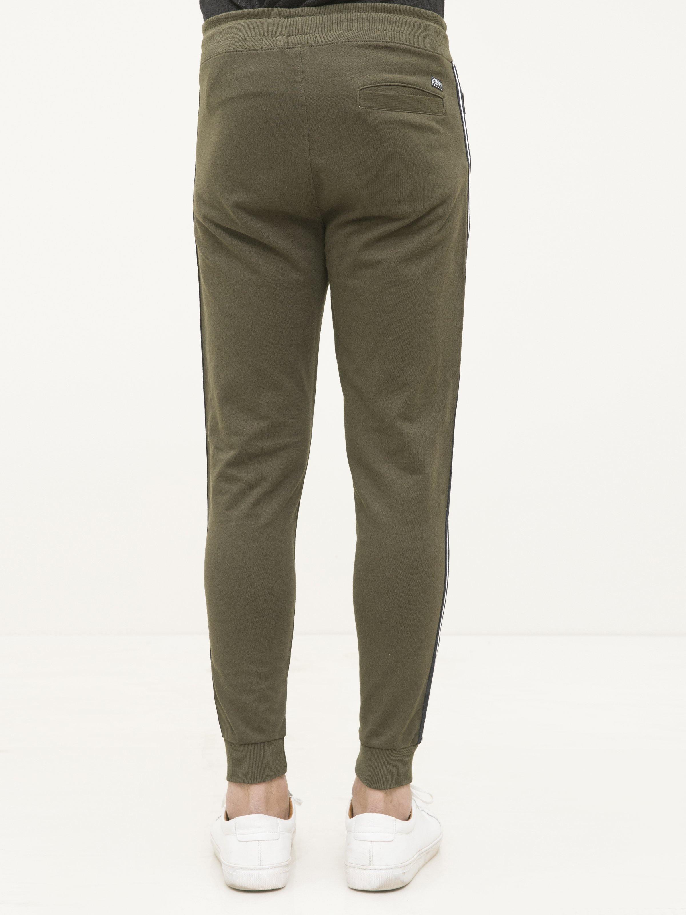 Dark olive terry trousers, back view, cuffed ankle with side tape stripe