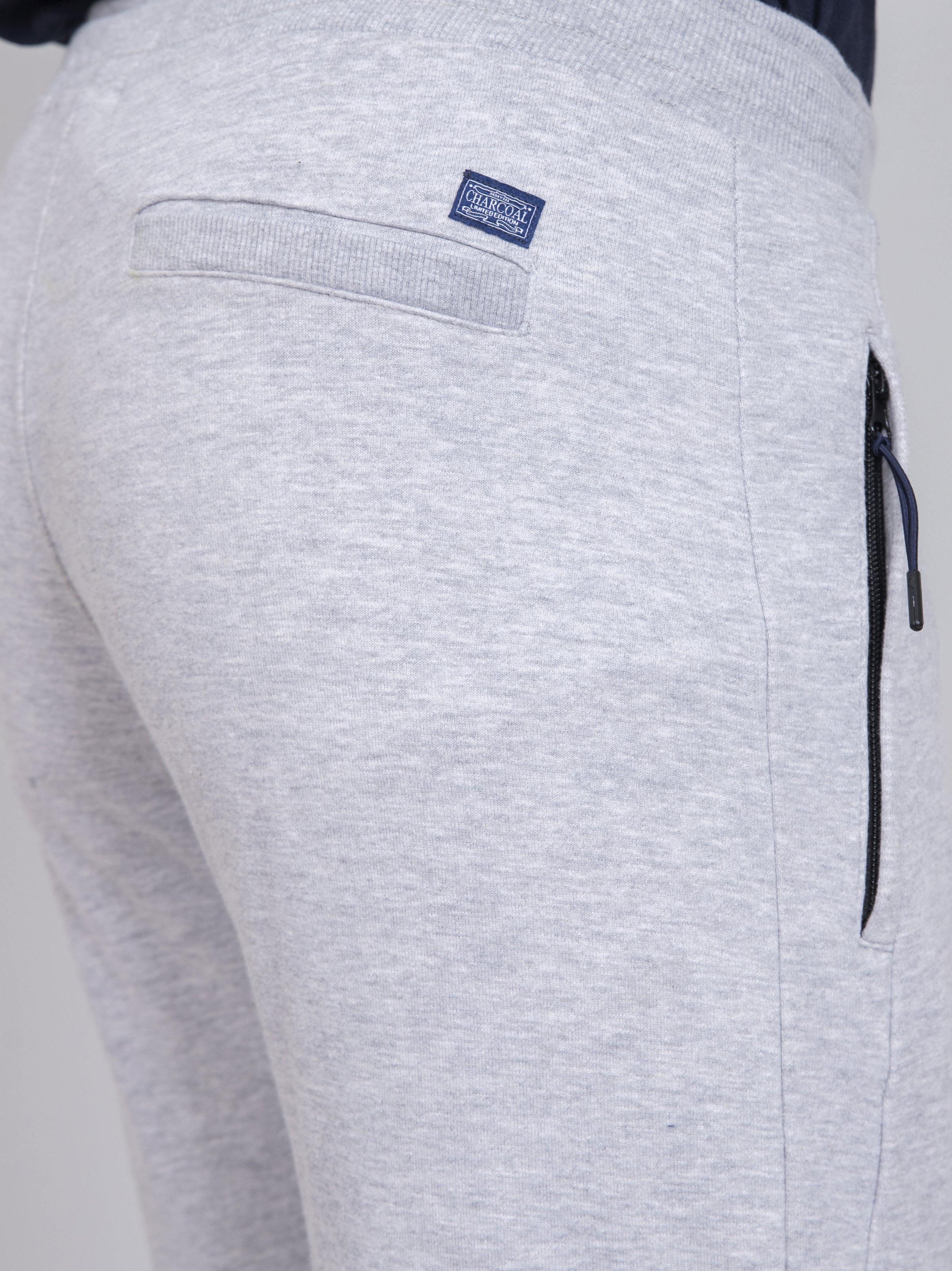 Grey melange terry trousers, back waistband patch label and drawstring tie