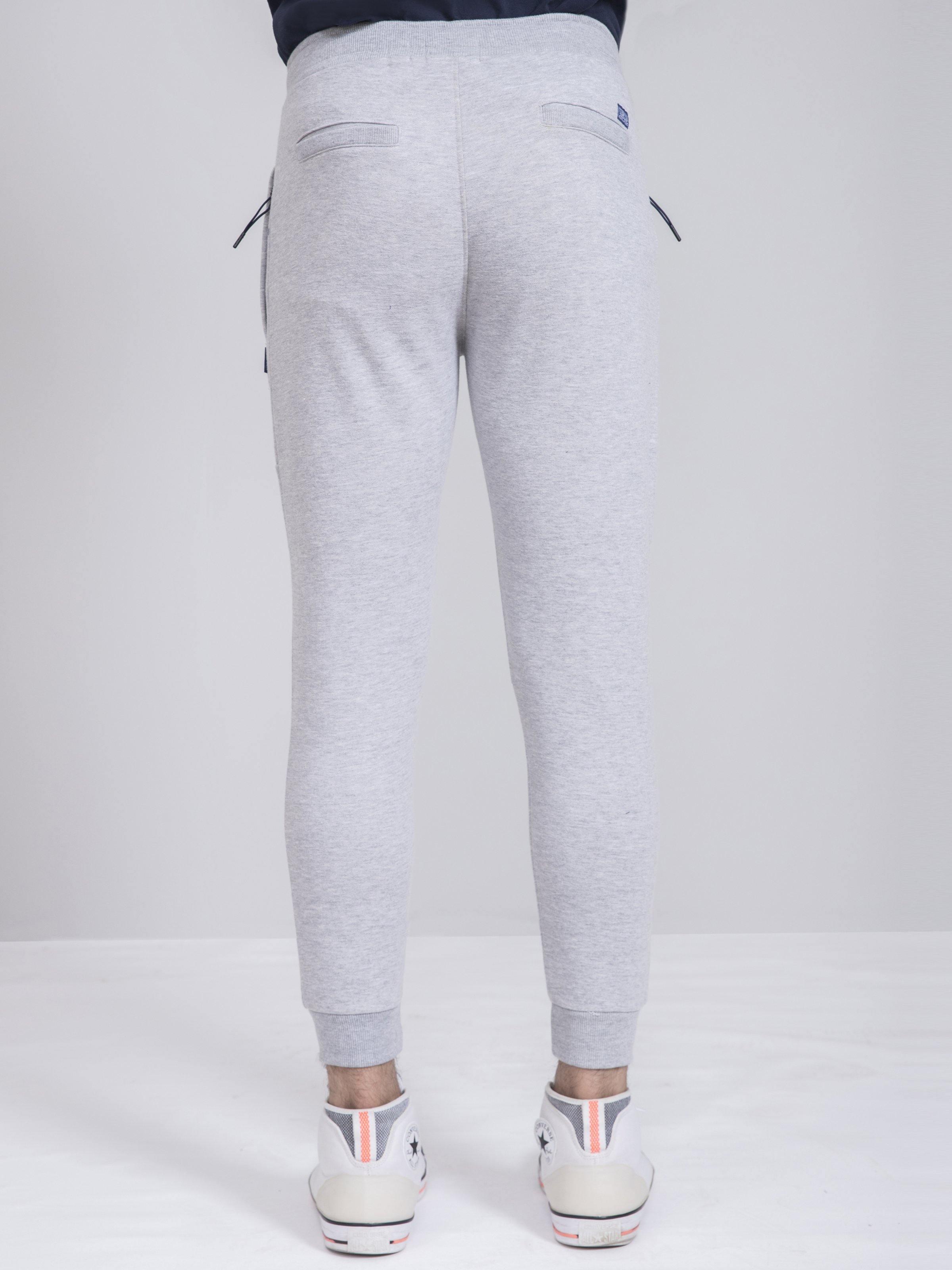 Grey melange terry slim-fit trousers, back view with curved yoke and seams