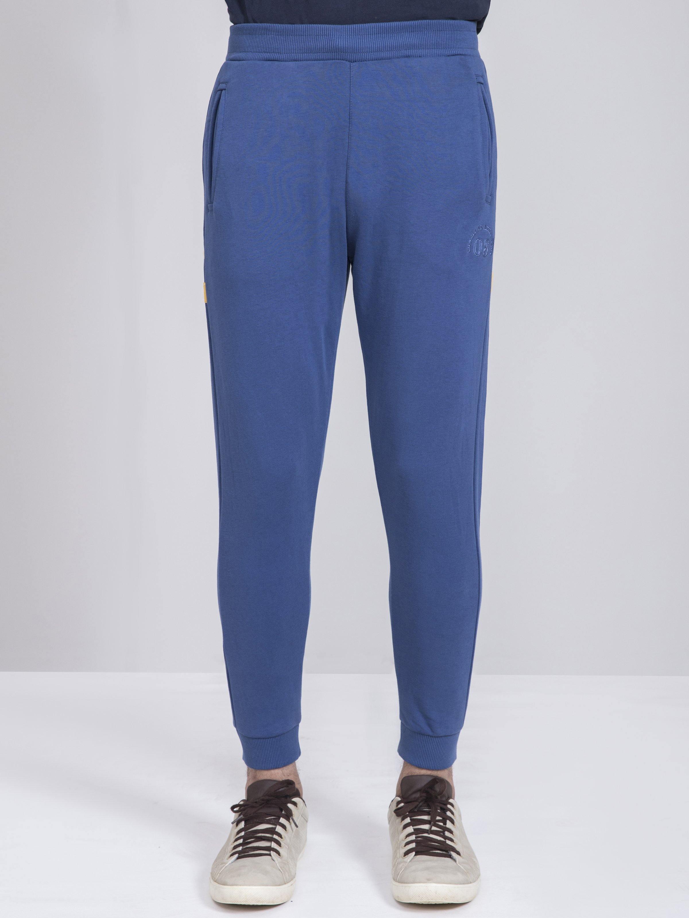 Slim-fit terry trousers in blue with tapered legs and ankle cuffs