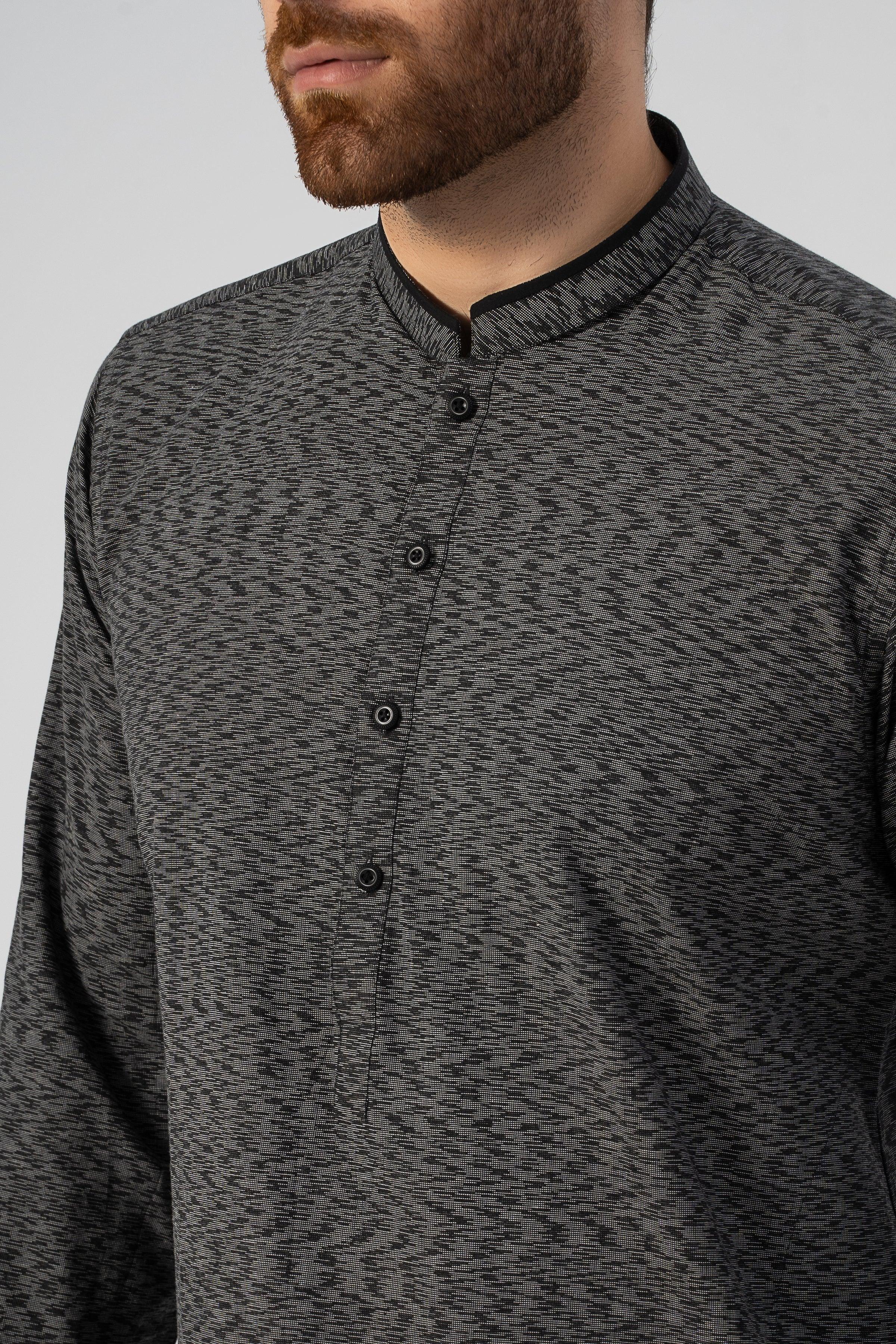 Black textured kurta close-up: stand collar with buttons and woven fabric texture