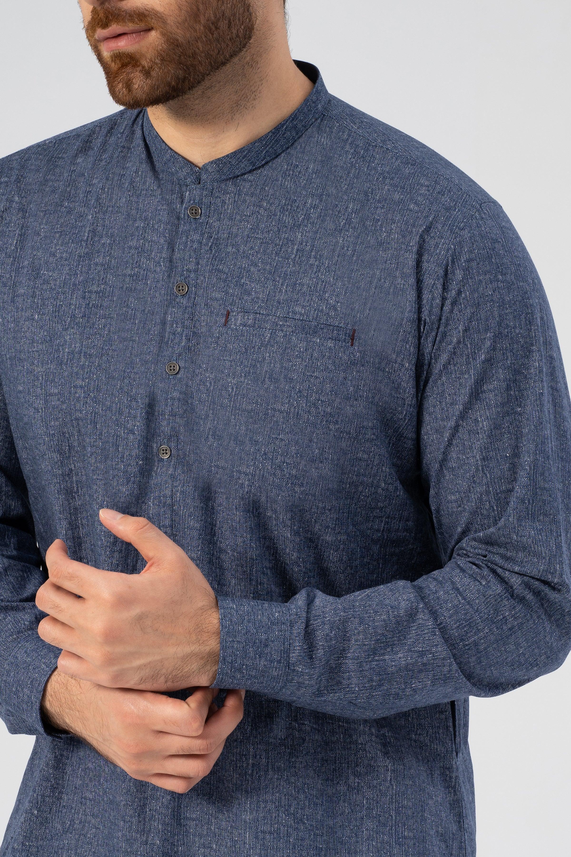 Denim-blue textured kurta close-up: button placket and chest pocket
