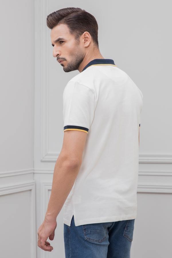 White tipping polo shirt, side view with navy sleeve and collar trim