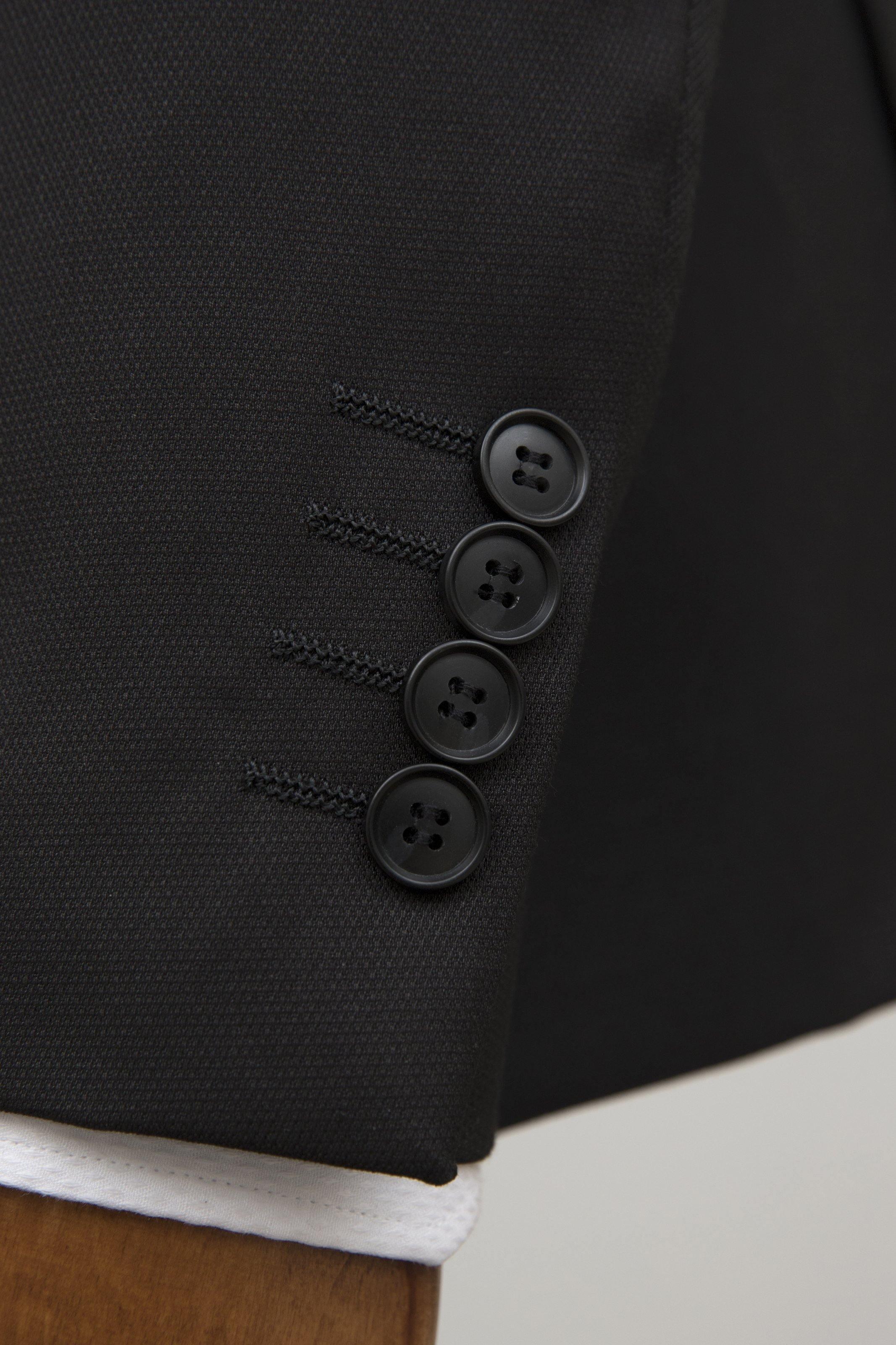 Black tuxedo jacket sleeve with three button cuffs