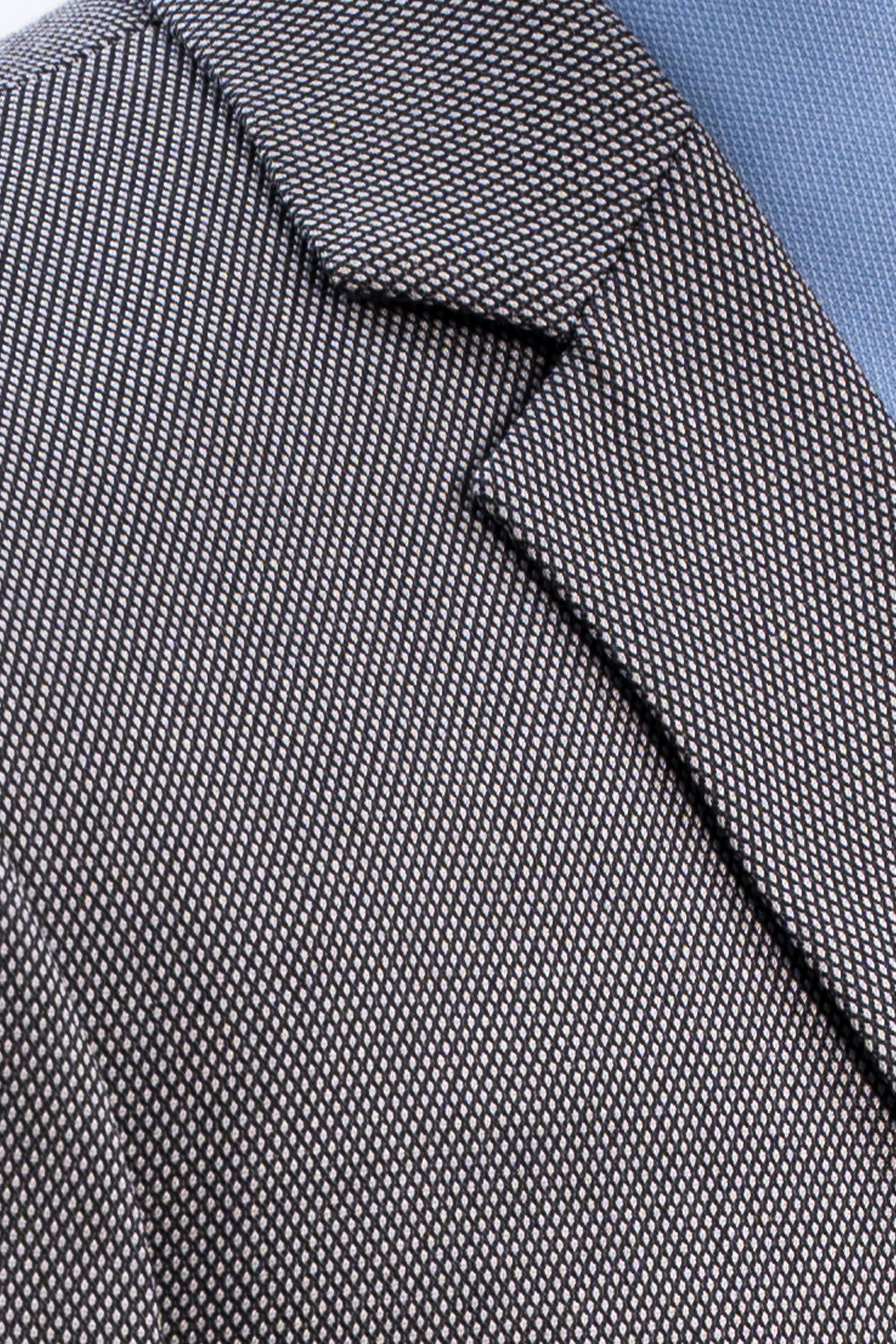 Geometric patterned necktie in dark blue with textured woven finish