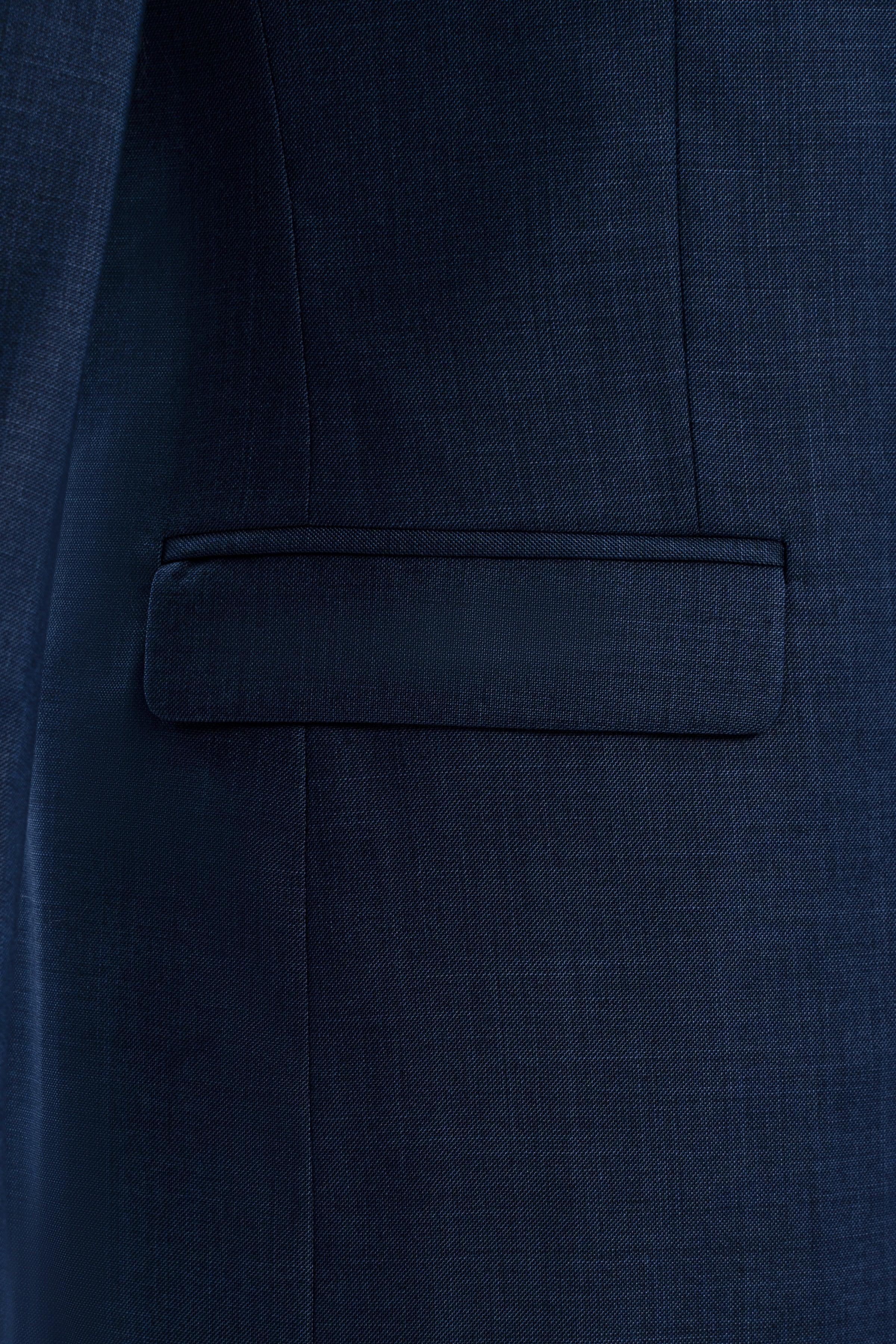 Blue suit jacket front chest pocket with flap