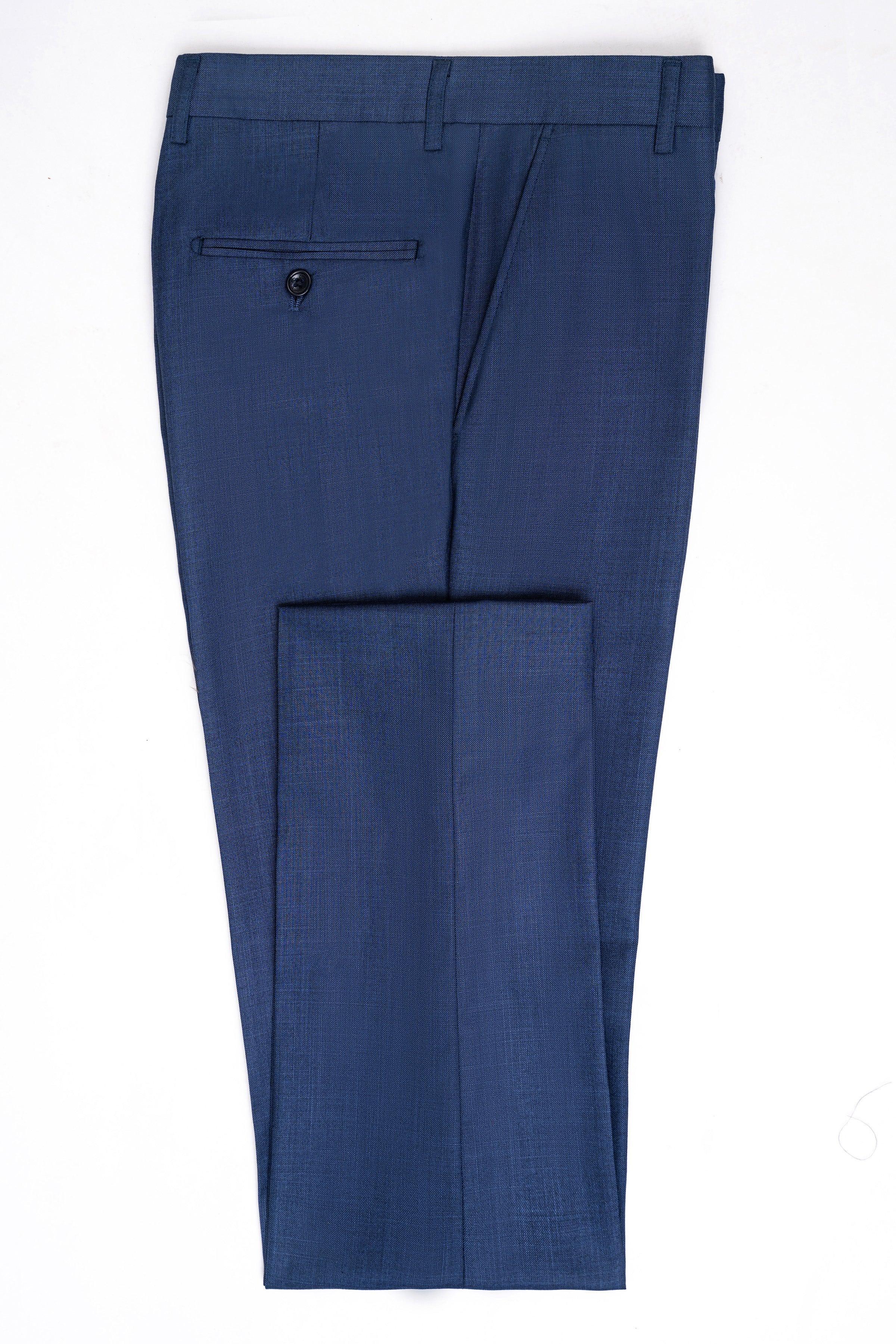 Blue slim-fit suit trousers with flat front, belt loops, and button closure
