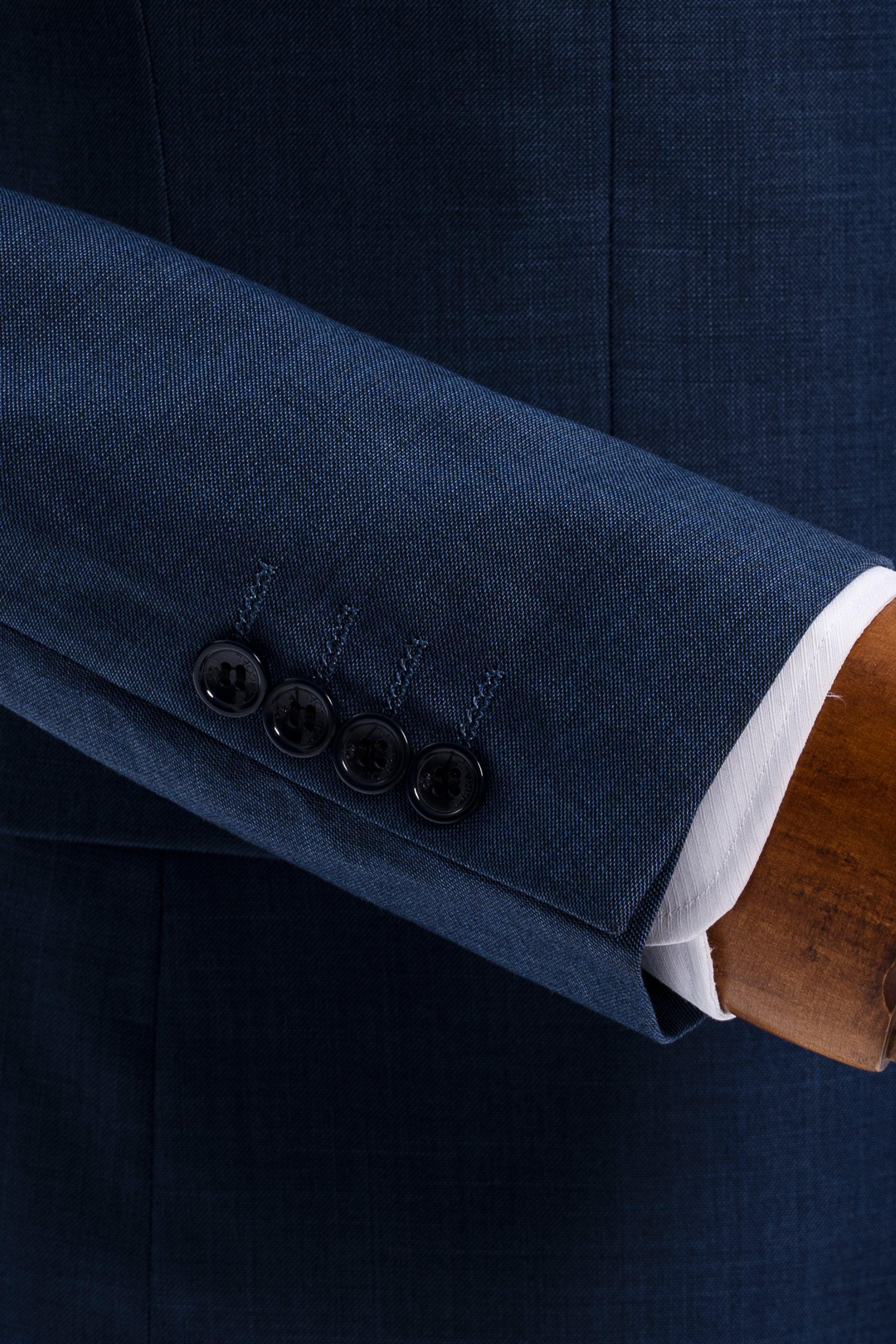 Blue suit jacket sleeve cuff with four dark buttons