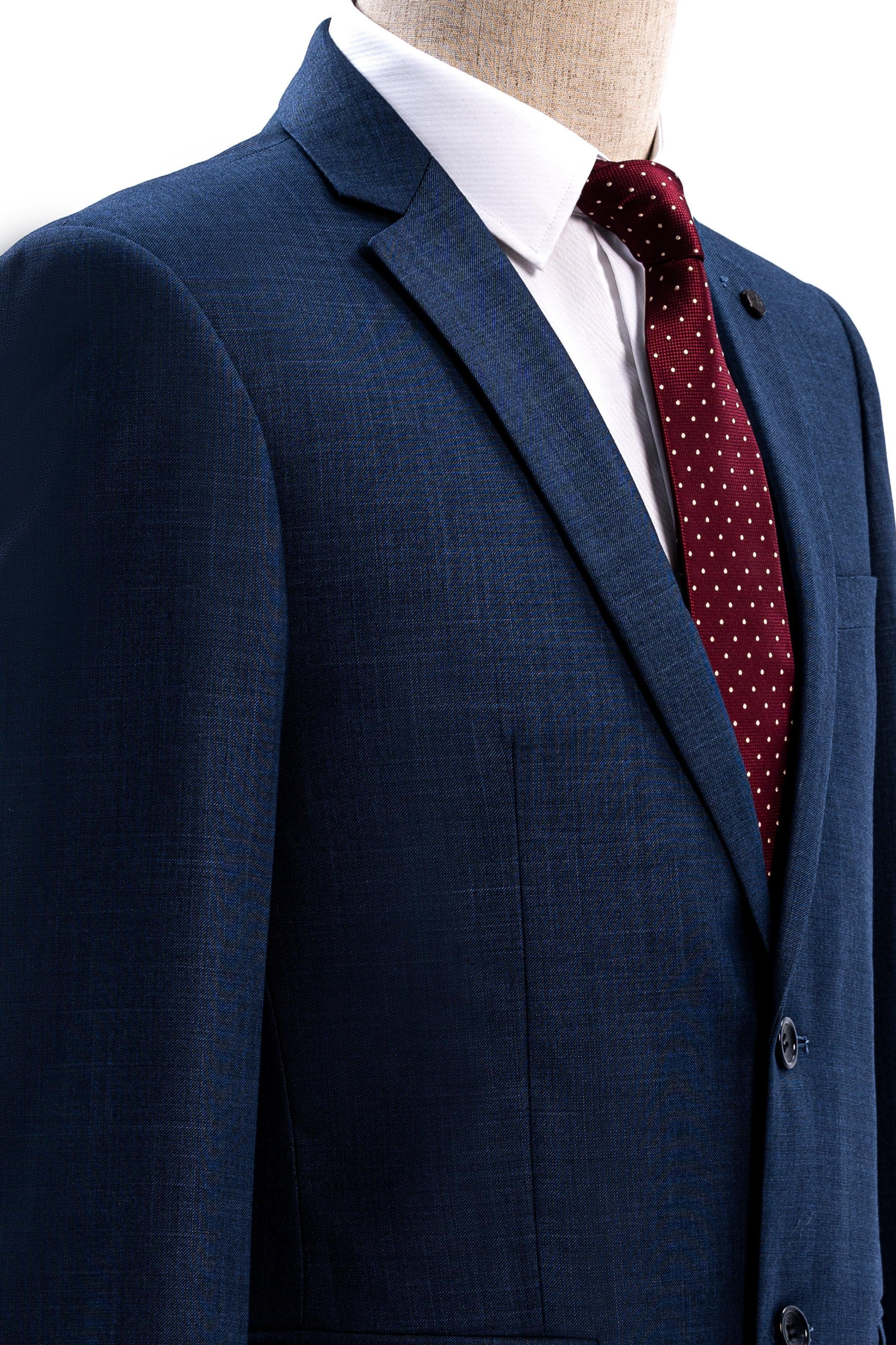 Blue slim-fit suit jacket shoulder and notched lapel button detail