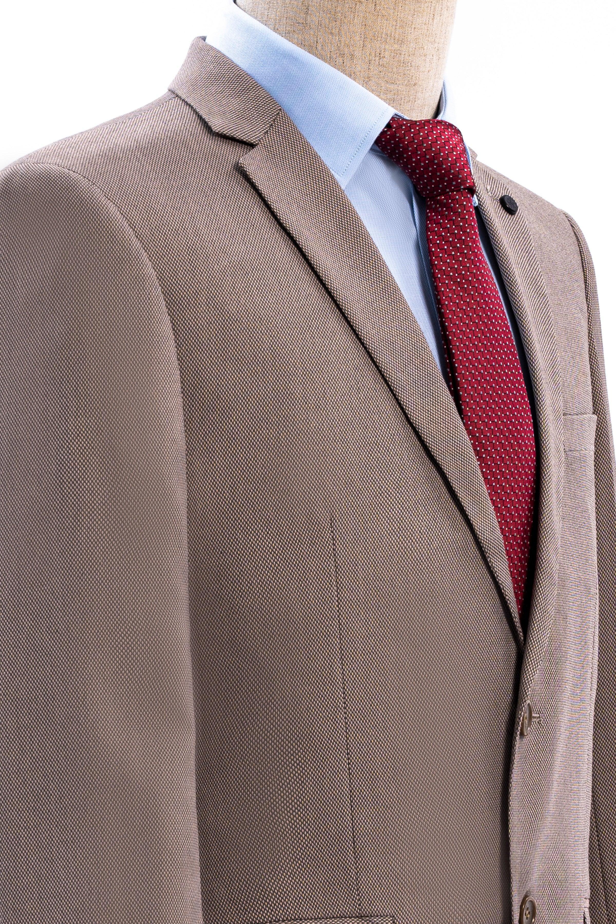 Taupe suit jacket lapel and shoulder with red textured necktie