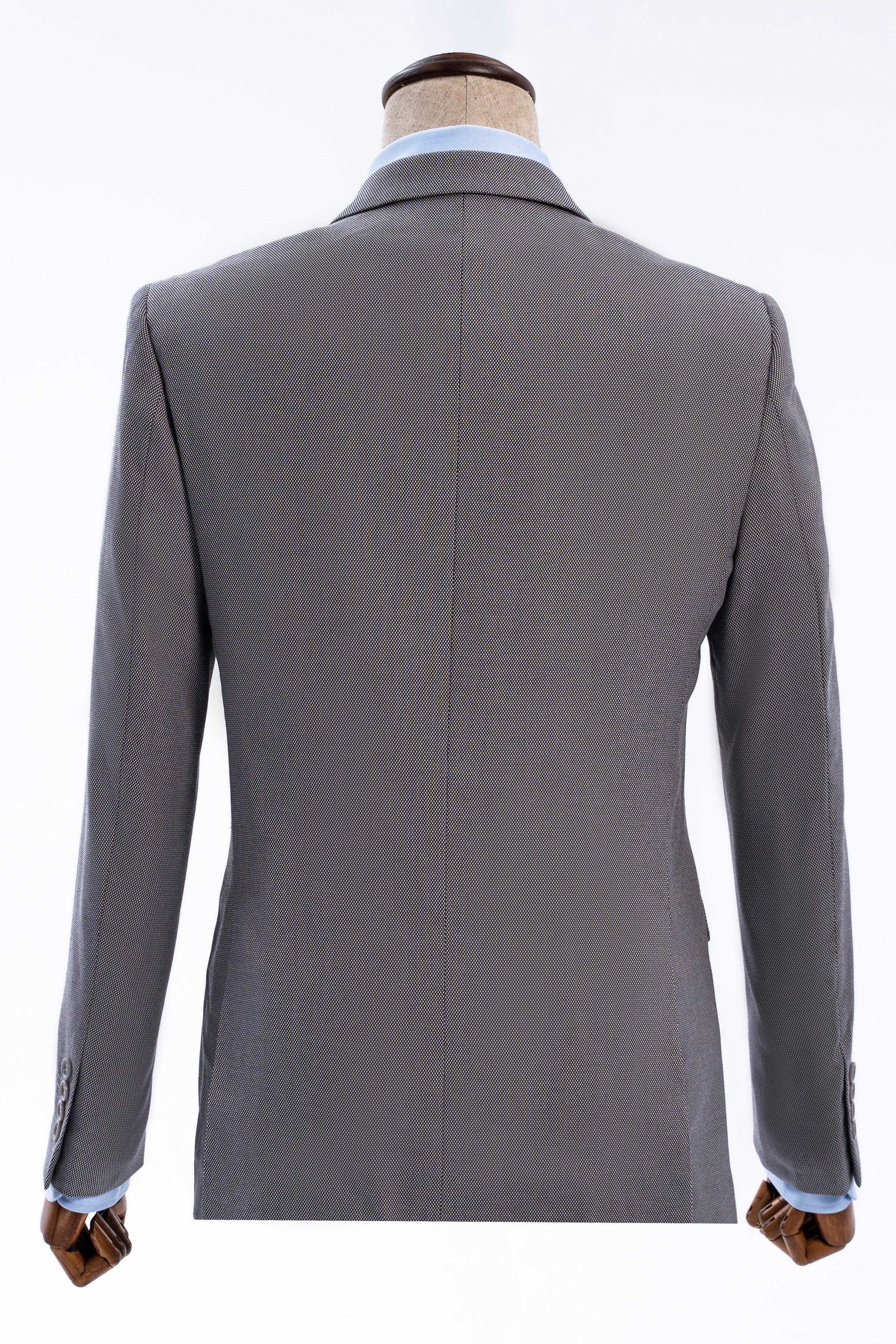 Slim-fit suit jacket back view in medium gray with vent detail at hem