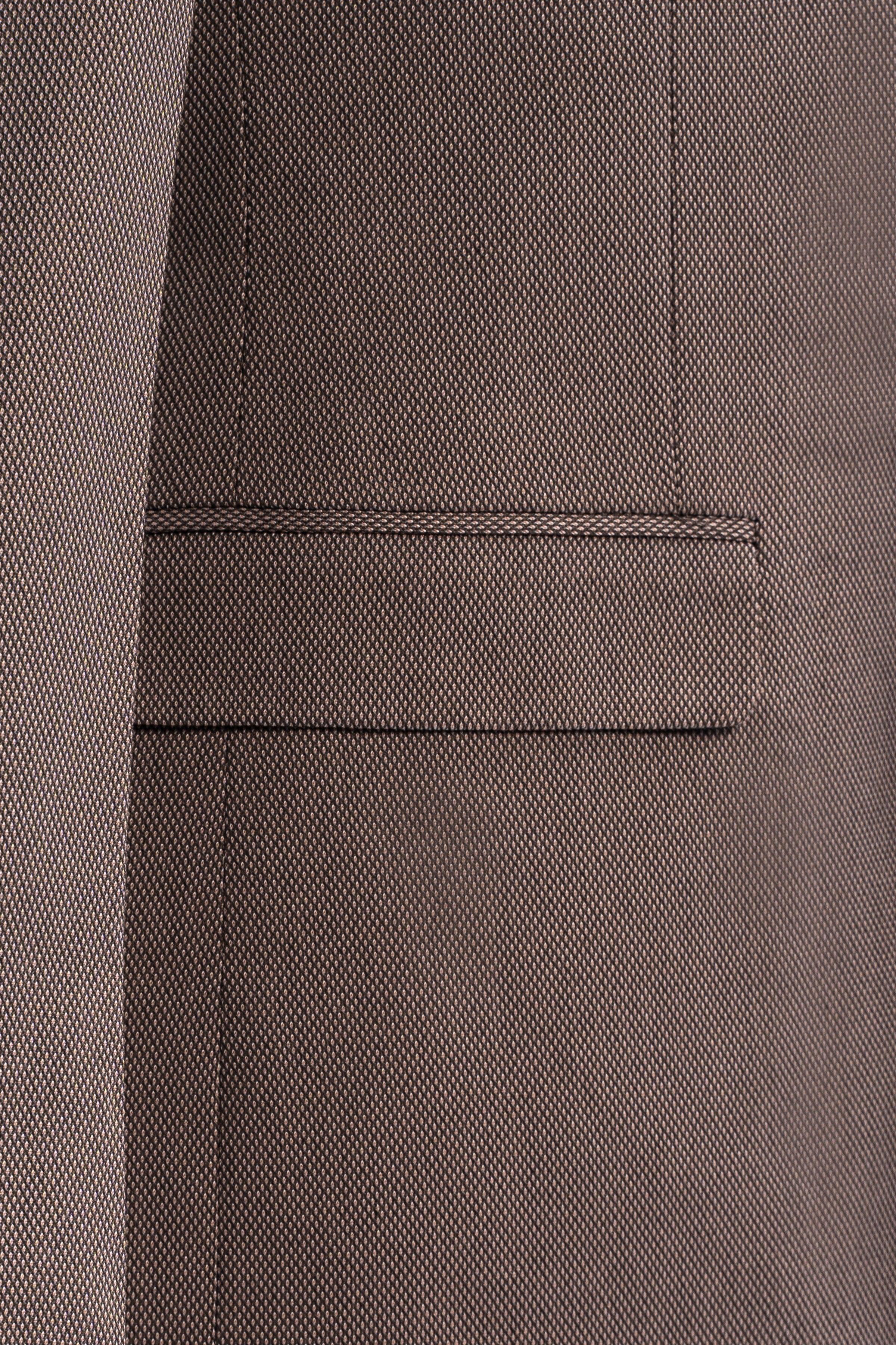 Taupe suit jacket pocket flap and side seam detail