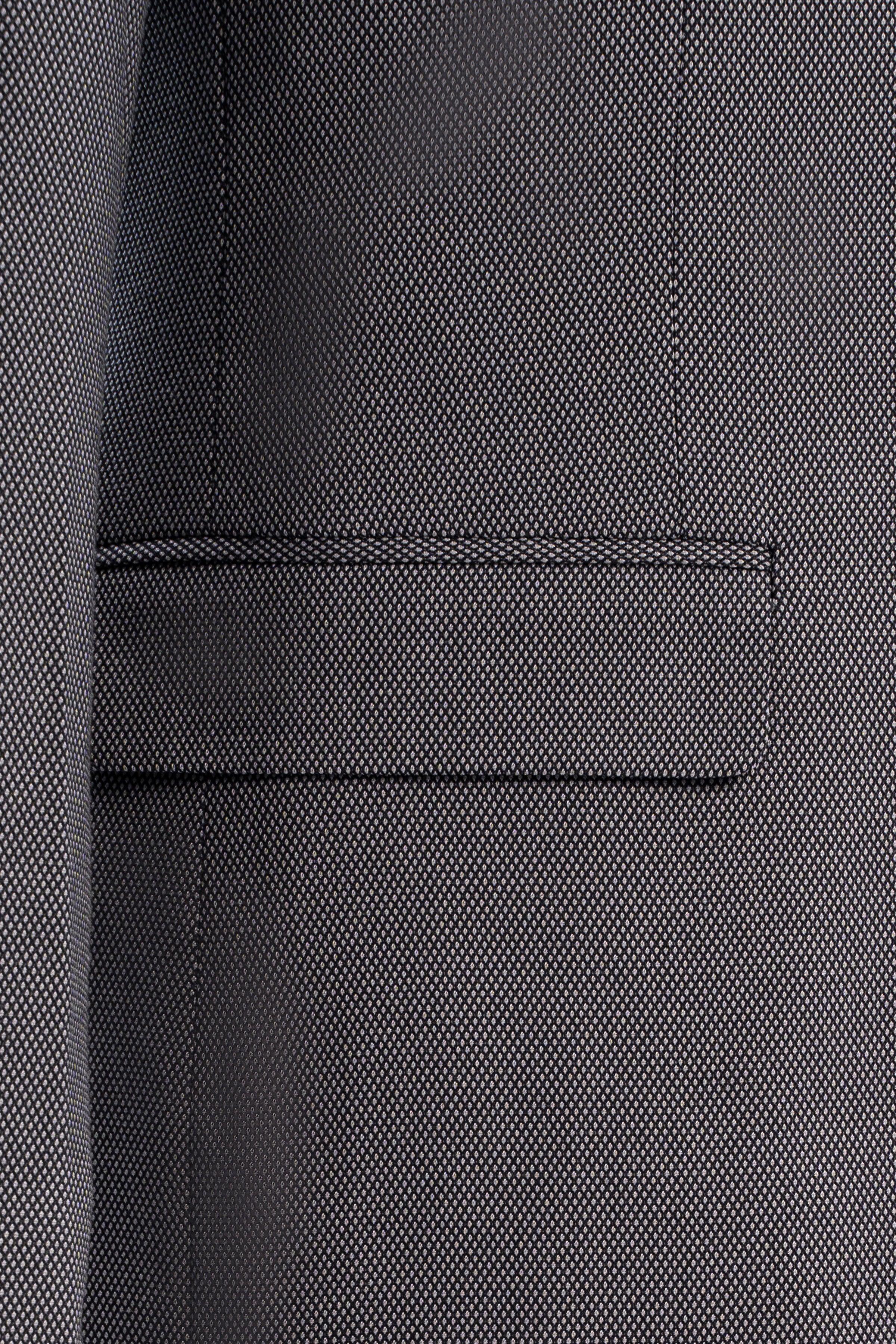 Suit jacket welt pocket detail in medium gray with straight flap