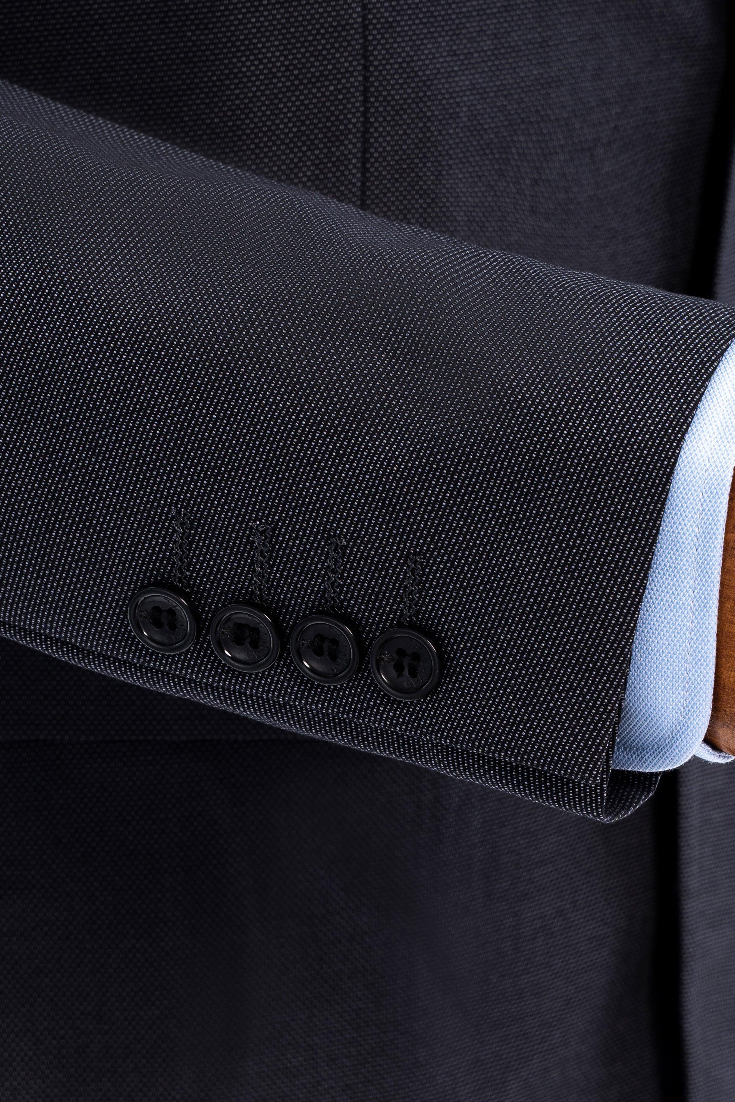 Slim fit suit jacket cuff with four buttons, dark textured fabric