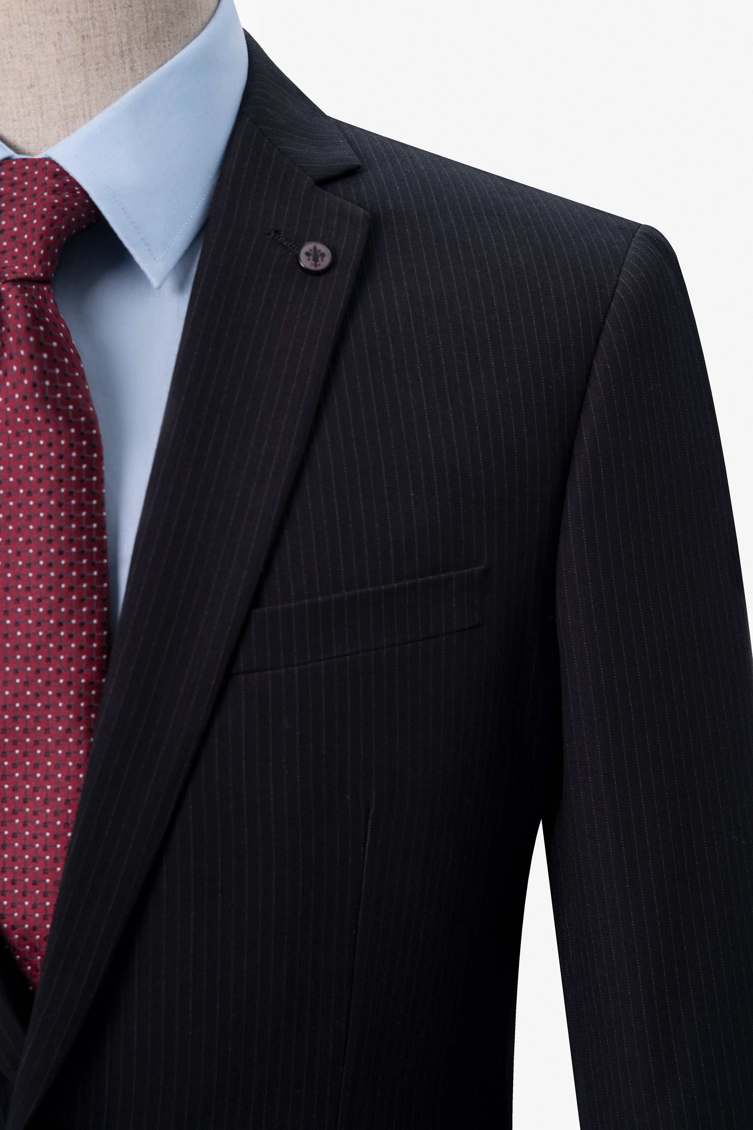 Black suit blazer shoulder with pocket square and red patterned tie