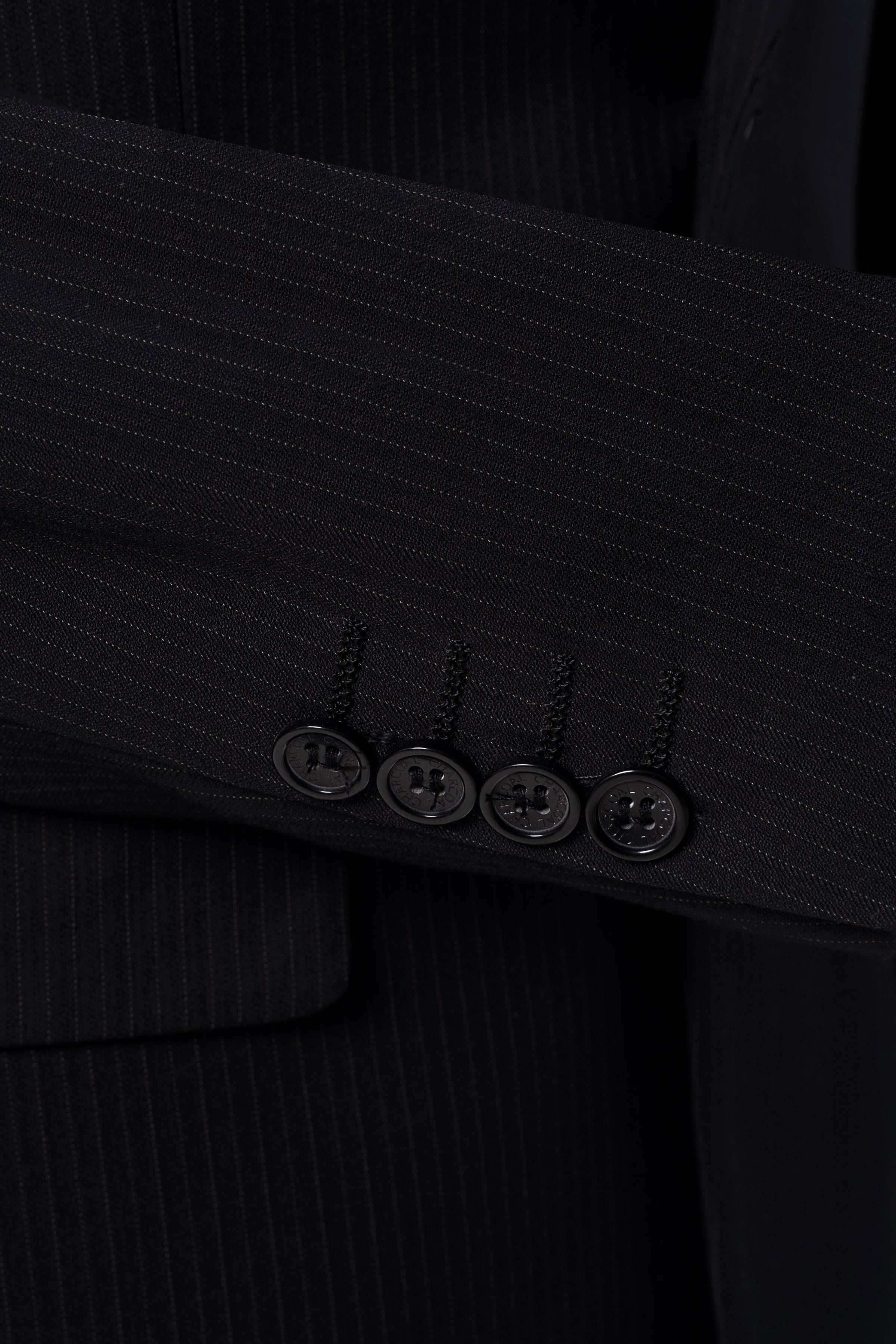 Black suit blazer cuff with four buttons