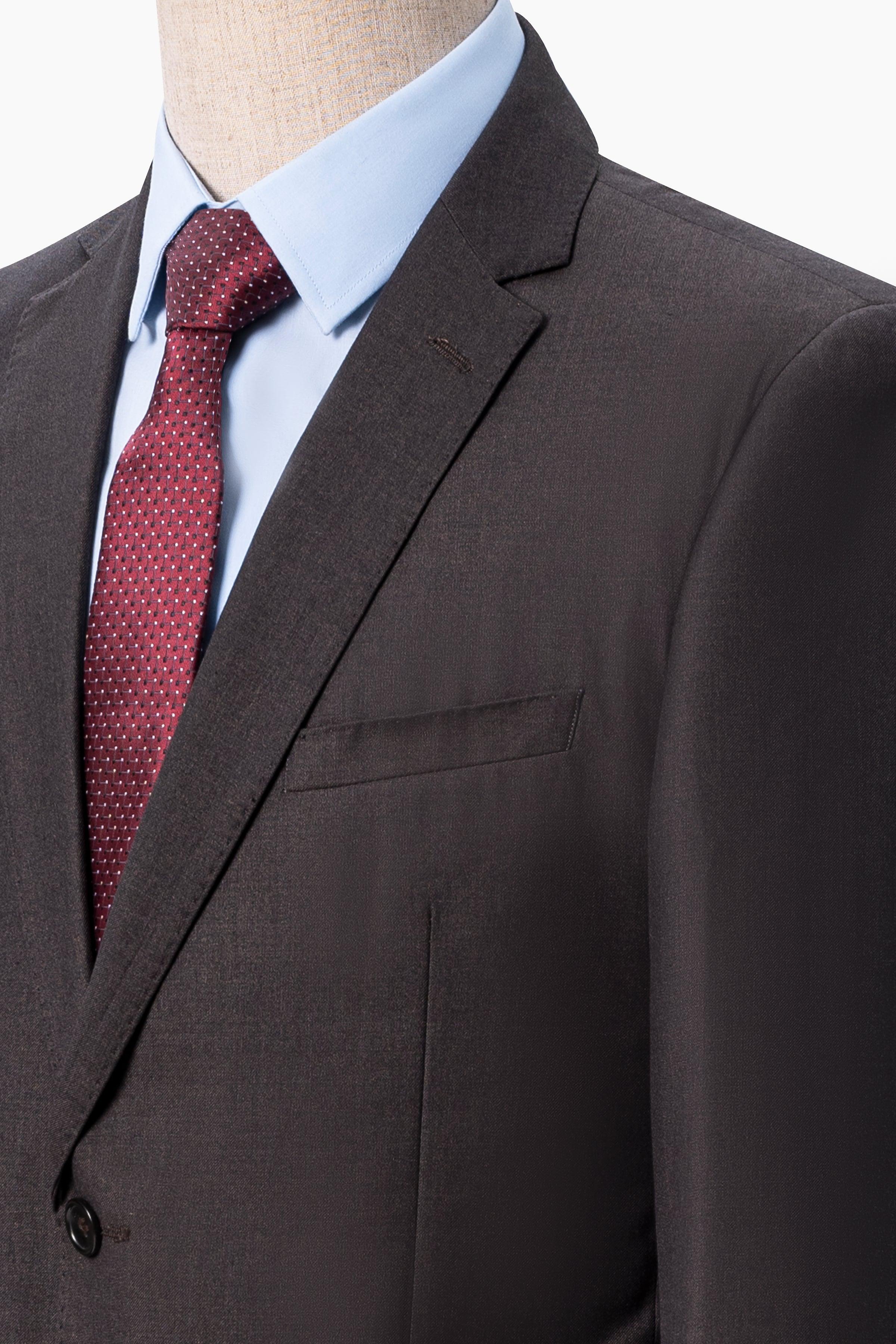 Suit jacket lapel, dark brown, with red dotted tie and light blue shirt
