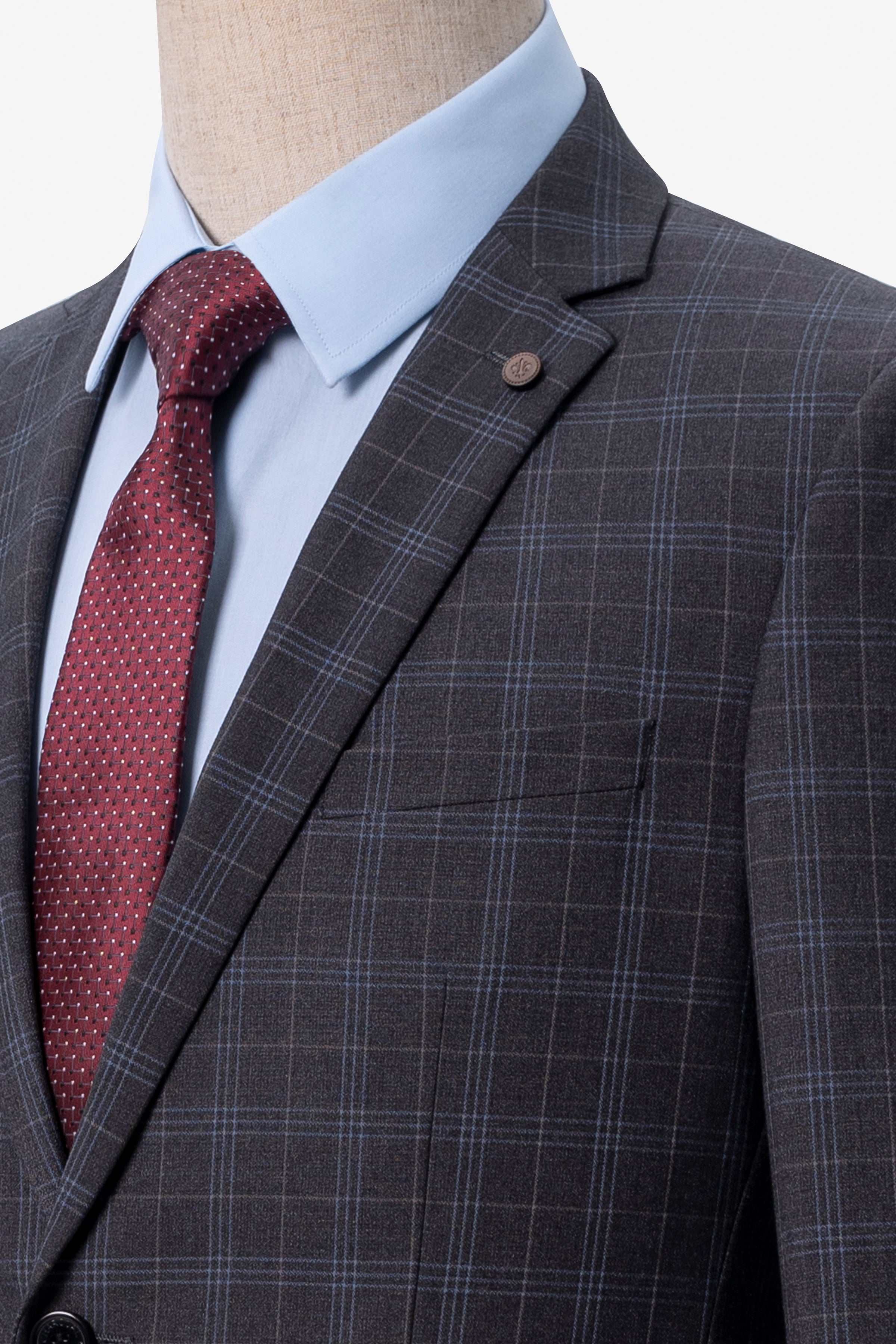 Charcoal check suit jacket lapel with welt pocket, paired with red tie