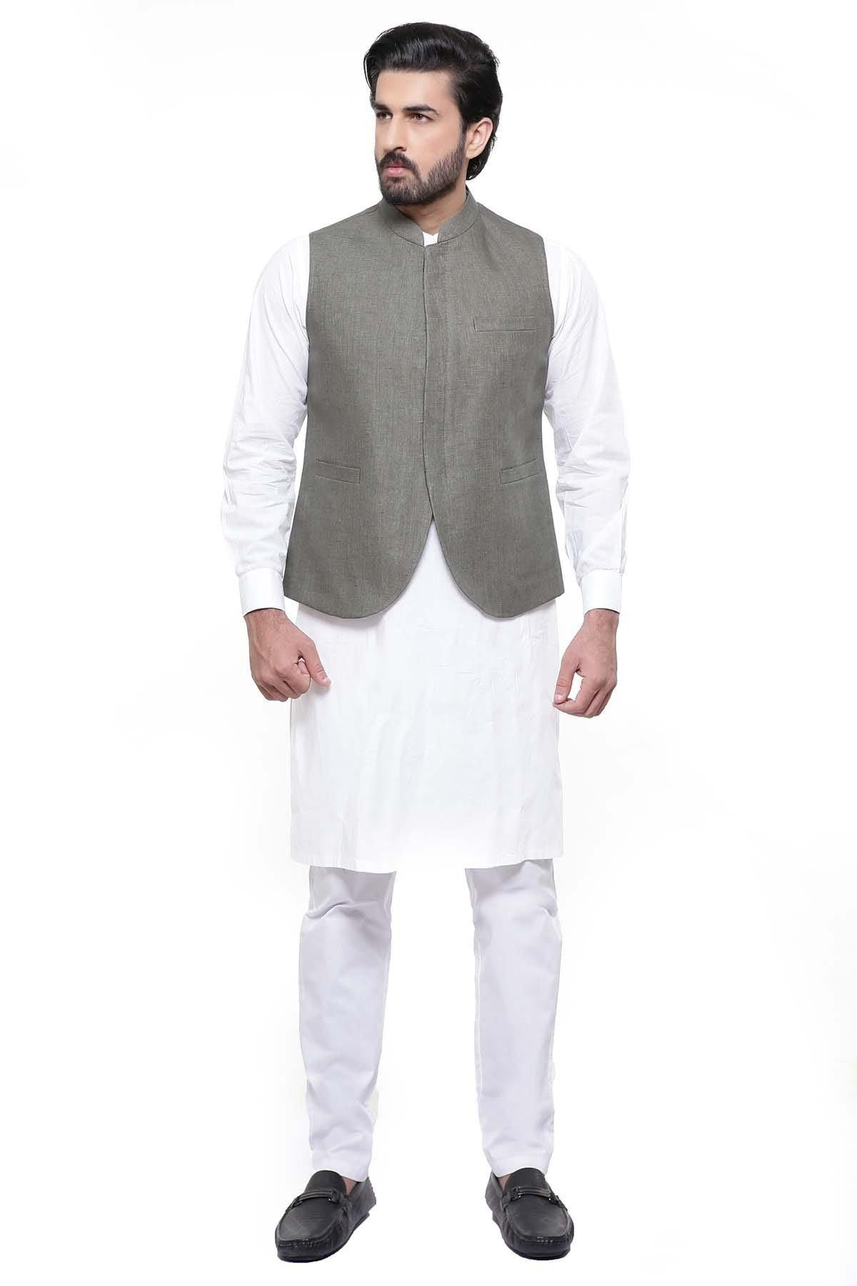 Green waist coat with front zipper and stand collar, sleeveless over white kurta