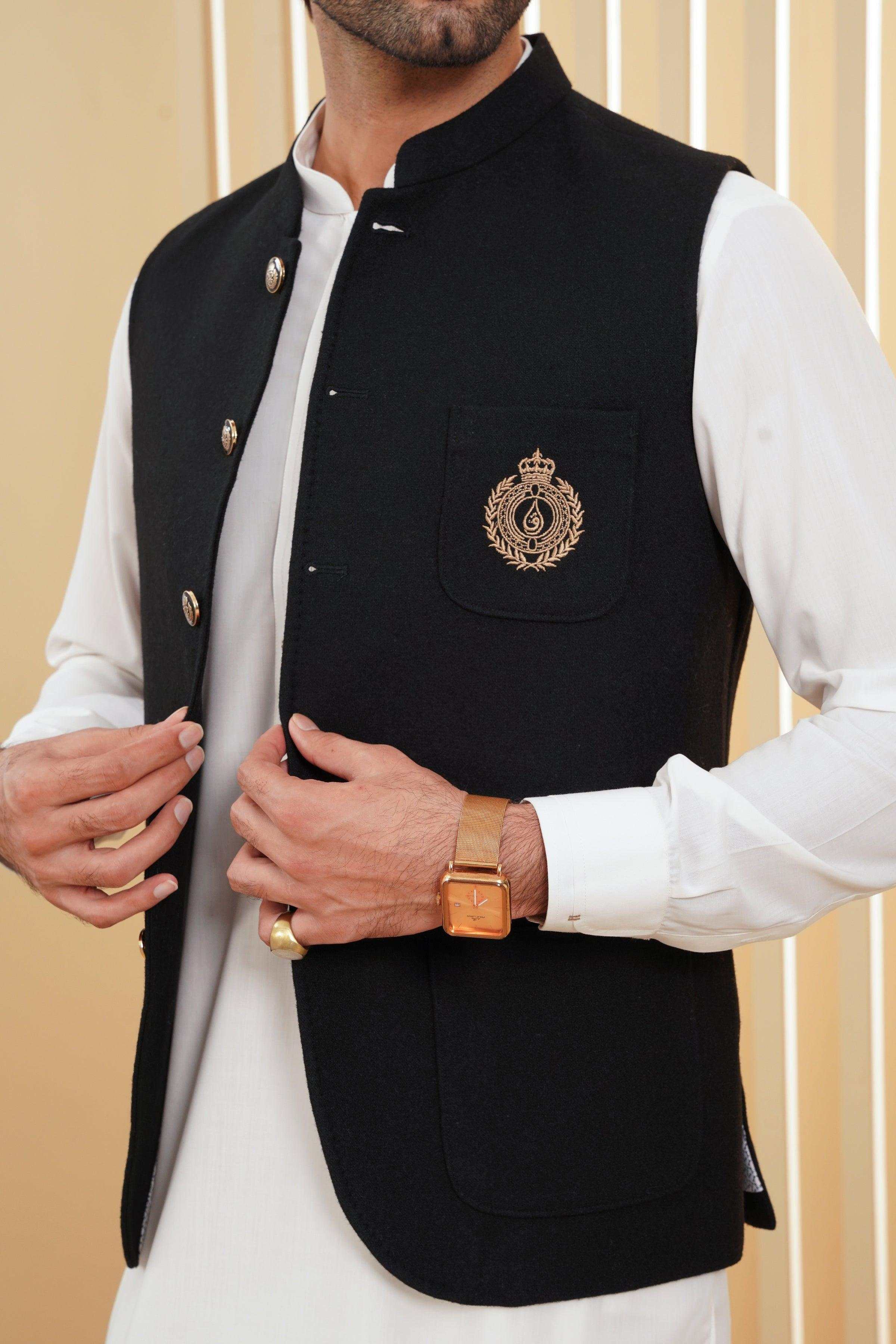 Black waistcoat with decorative crest, gold buttons, and chest welt pocket