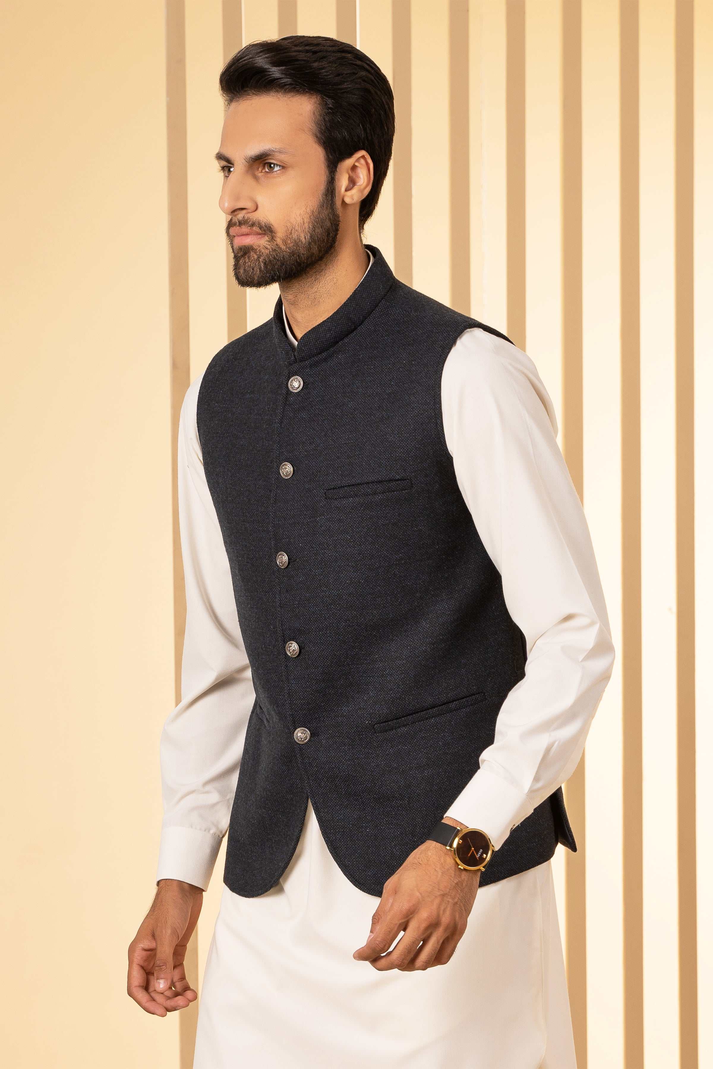 Blackish-blue waistcoat with stand collar and four buttons, side profile view.